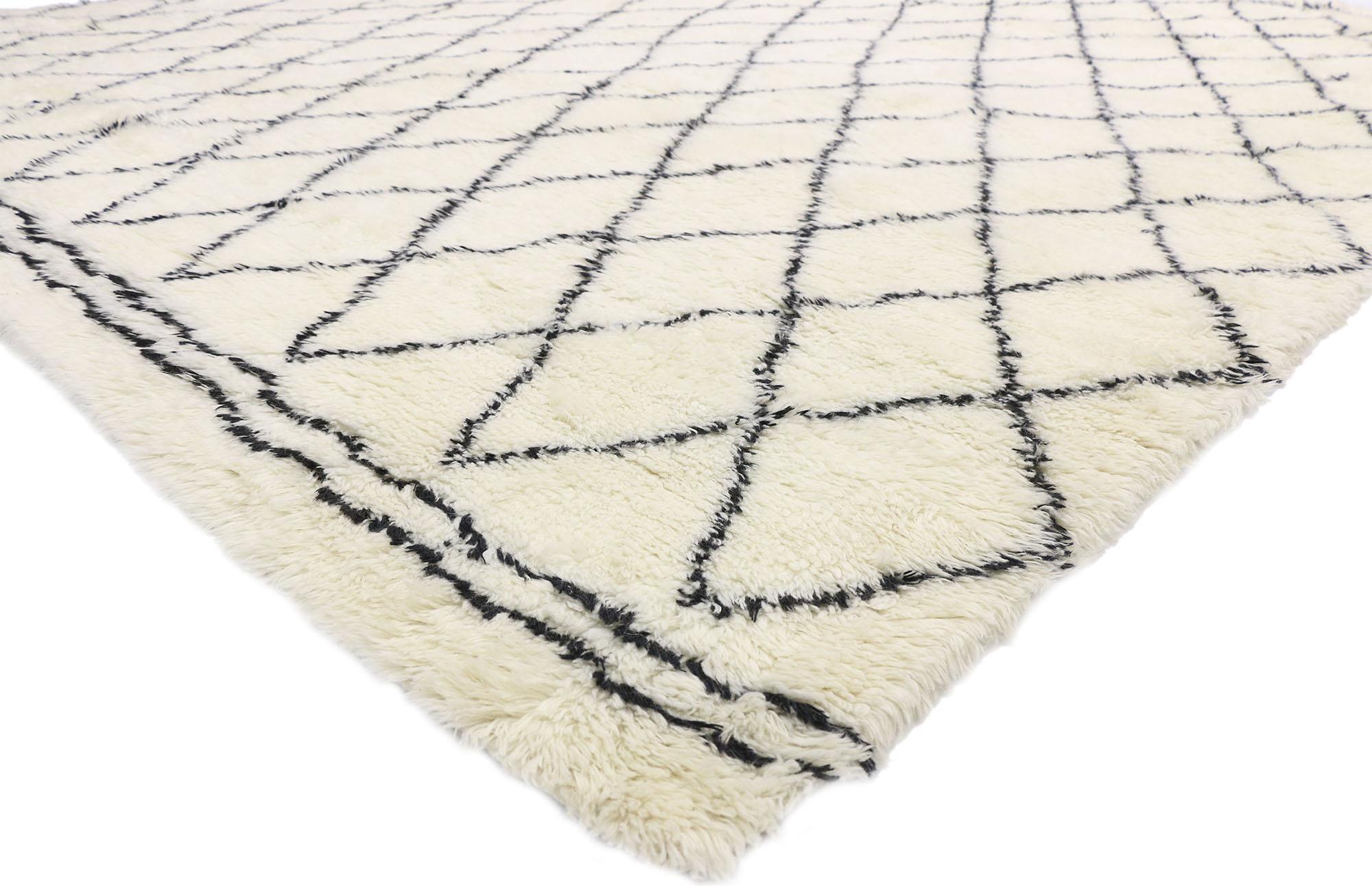 30411, contemporary Moroccan style area rug with Minimalist appeal. This hand knotted wool contemporary Moroccan style rug features a simplistic all-over diamond lattice pattern spread across an abrashed creamy-vanilla field. The black lines