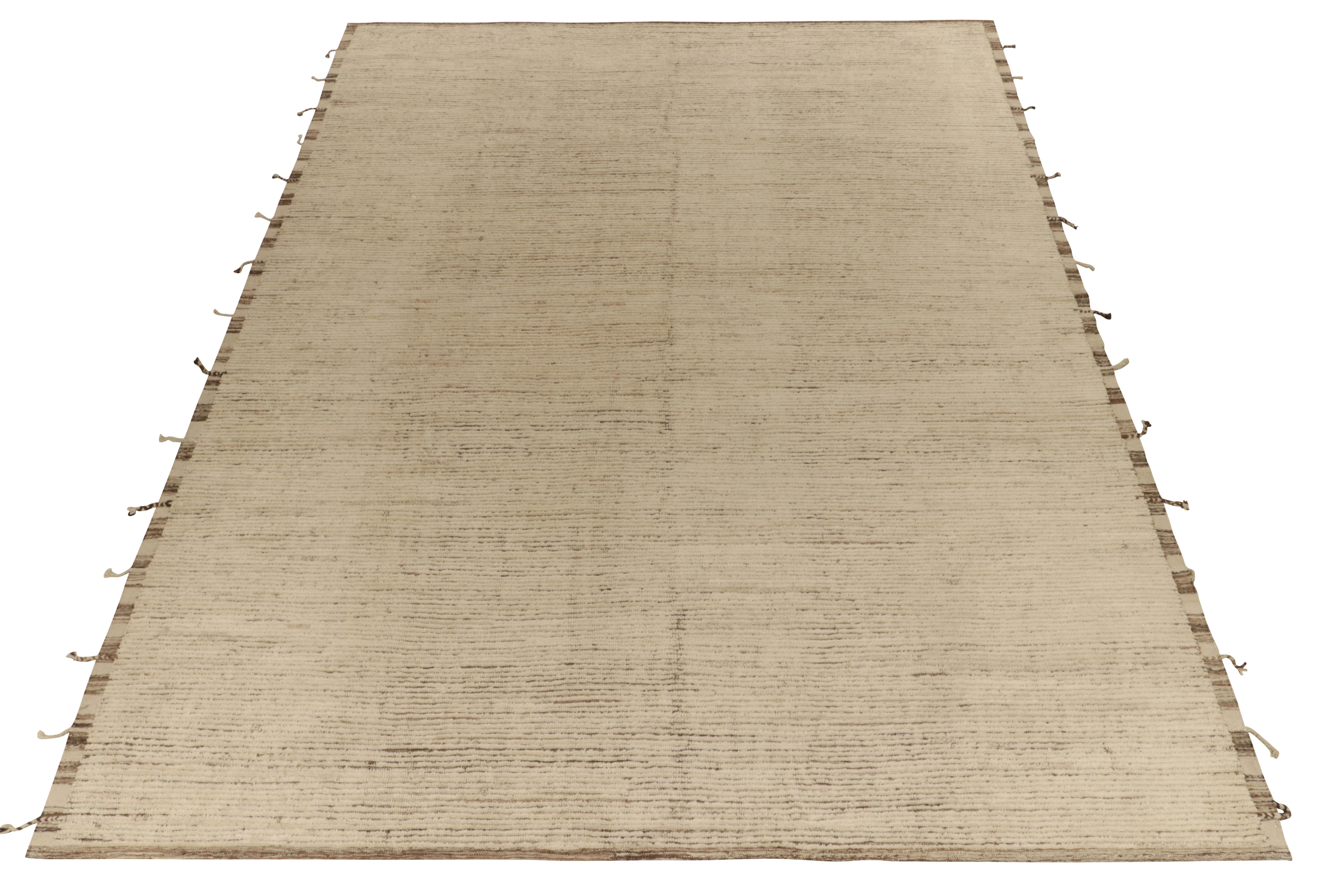 Rug & Kilim presents a contemporary take on Moroccan style with this 11x14 hand-knotted piece of sublime textural appeal. The rug enjoys a comfortable high low appeal in forgiving beige brown striations concluding to fringes on the borders for
