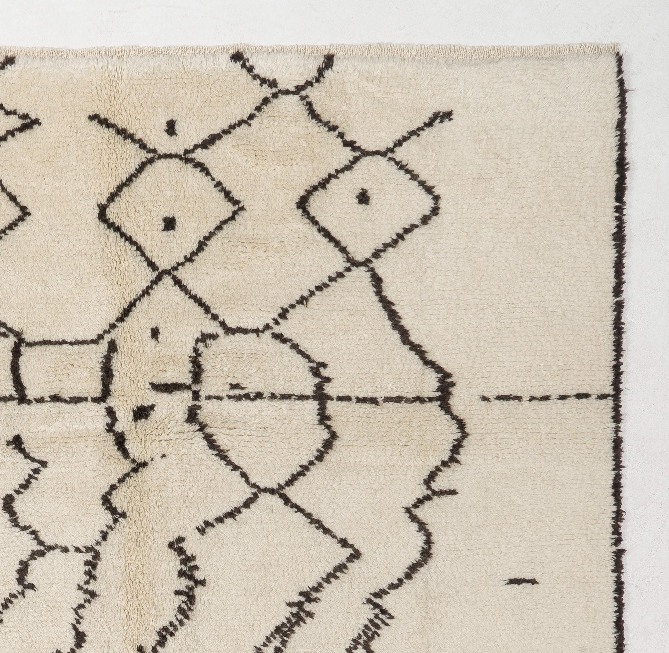 A contemporary hand-knotted Moroccan rug, made of plant dyed sheep wool. Measures: 8 X 10 ft.
Soft, comfy pile that is ideal for families with kids.
Available as it is or made to measure in any size and color combination requested.