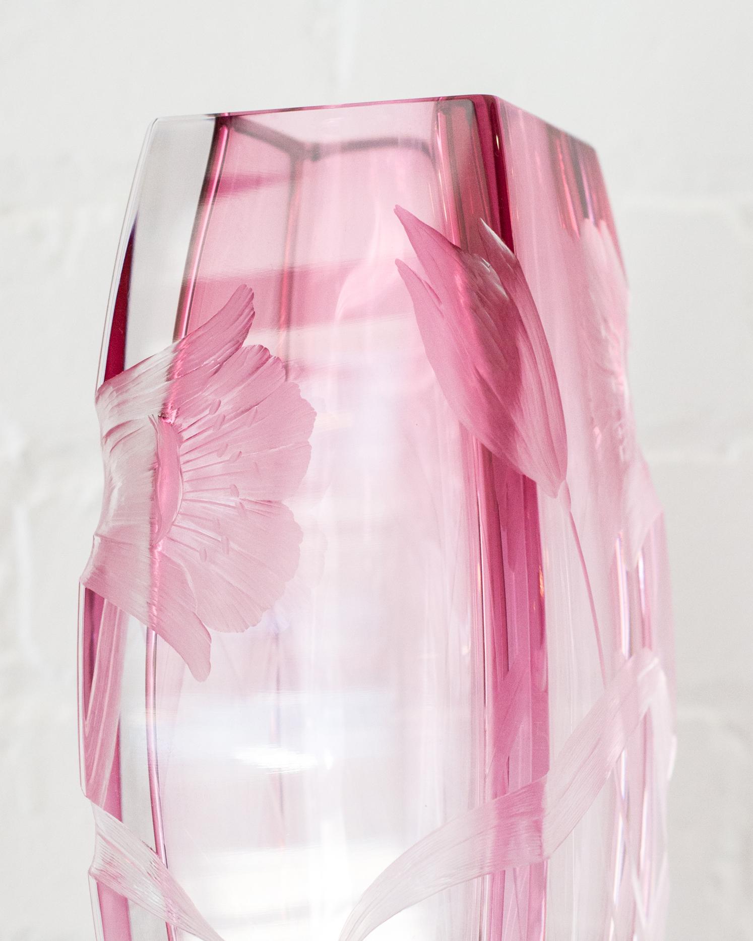 The only thing better than receiving a bouquet of flowers is receiving them in an even more beautiful vase. This contemporary pink Rosalin Moser vase is hand blown, handcut, and is the perfect size to hold flowers. Even empty, it is a stunning