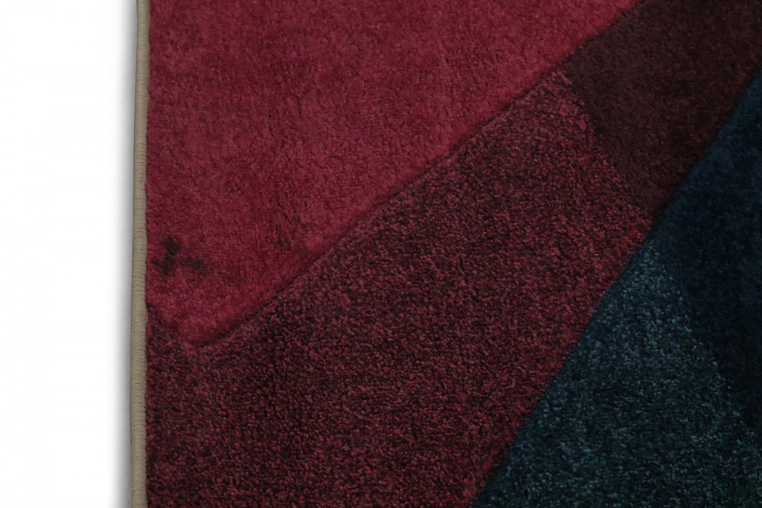 Moderner, mehrfarbiger, rechteckiger Teppich mit geometrischen Farbblöcken in Rosa, Lila, Blau, Gelb und Beige. Maße: (5' x 8').