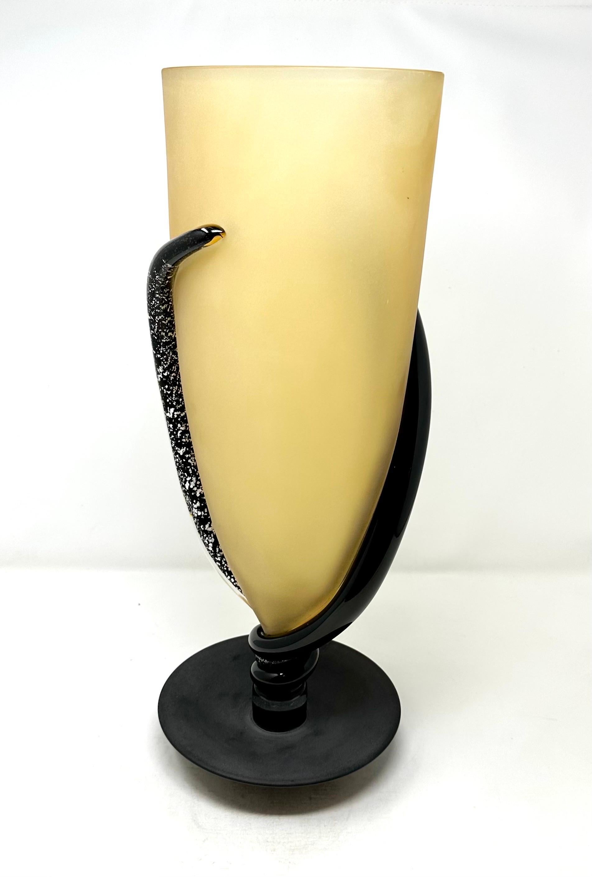 Contemporary Murano art glass vase by Marino Santi. A large and striking piece, in black and gold with white accents, signed on the underside and labeled. In excellent condition.

Width: 8 in / Depth: 8 in / Height: 19 in