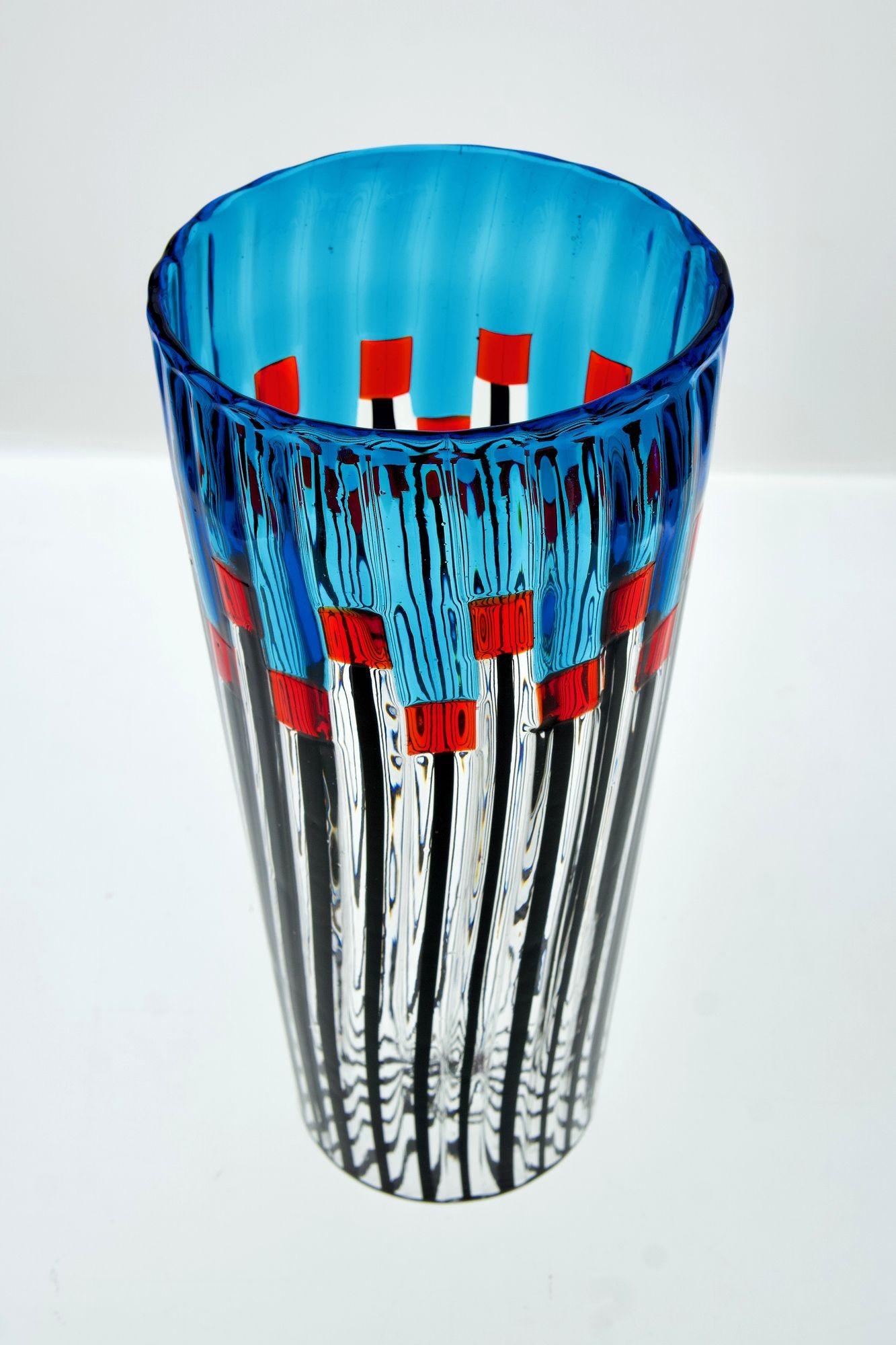 Vase of my own design, which I named “Field of a Thousand Red Poppies.”

Executed in a kiln in Murano with the very difficult working technique called “a piera.”
The design of the vase stylizes the flowering of a field of red poppies with a blue sky