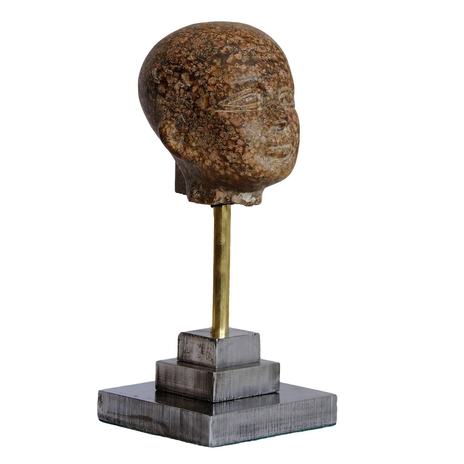 This is a really rather lovely contemporary museum copy porphyry head on a stepped cut steel base. 

Height: 78cm (11