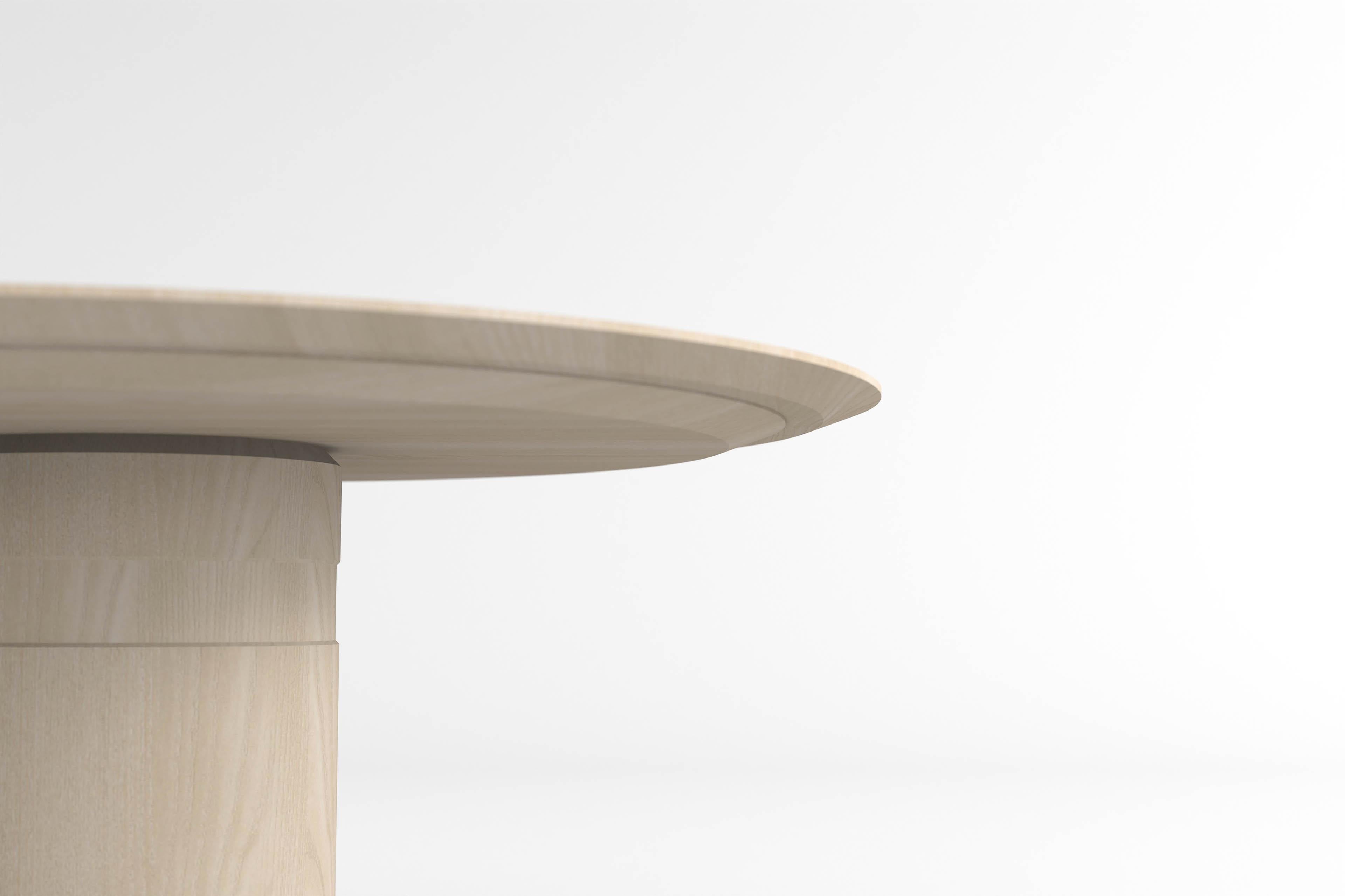 round dining table with central pedestal