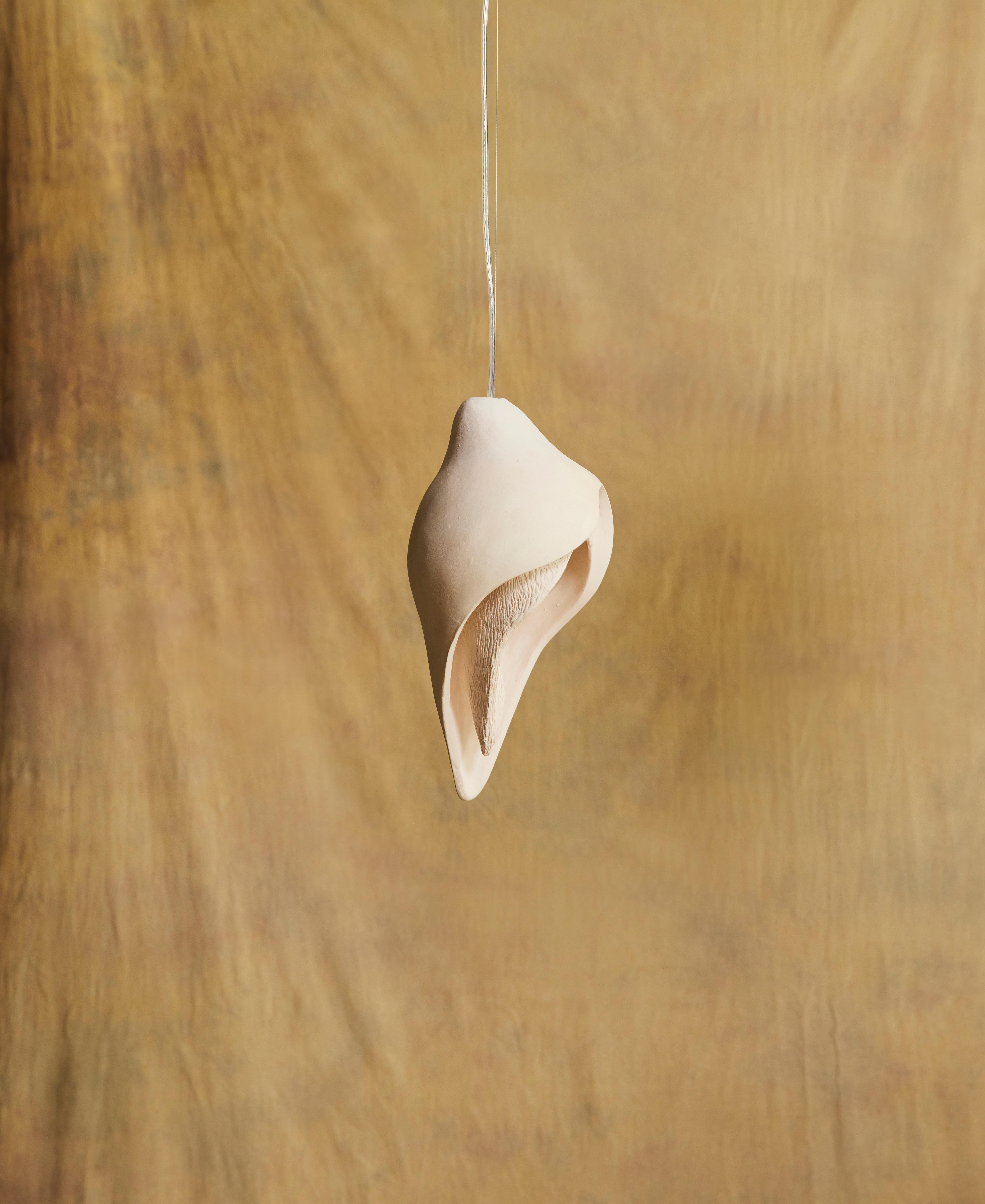 Hand-Carved Contemporary & Natural Beige Clay Womb Pendant Small For Sale