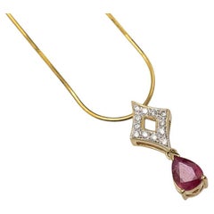 Contemporary necklace with ruby and diamonds, pendant chain 14-karat gold.