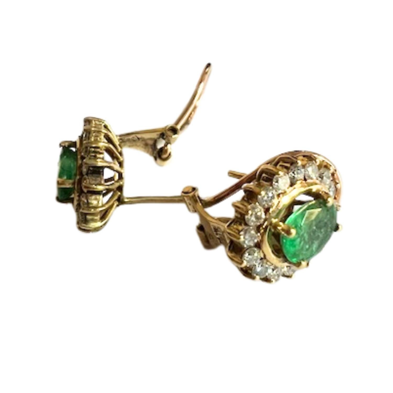 Elegant neo-classical rosette-style earrings crafted in 18k gold, featuring vibrant emerald centers surrounded by brilliant-cut diamonds. A timeless yet contemporary design with omega backs for secure and comfortable wear.

Technical Details:

Era: