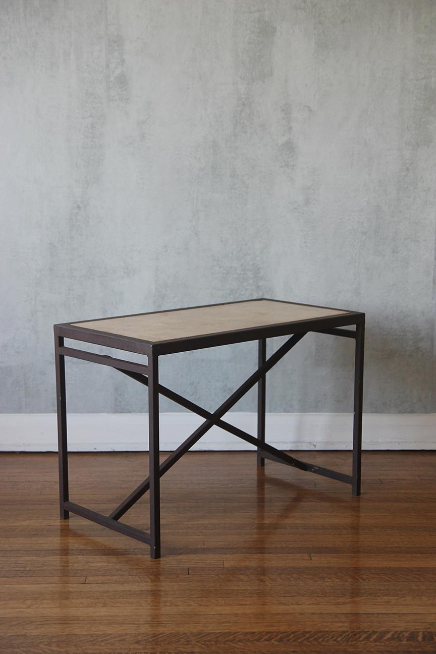 Inspired by the elegant French neoclassical movement of the mid-20th century, this rectilinear table is a remarkable addition to any space. It features a distinctive pointed 'x-form' detail at the front, giving it a unique charm. The base is