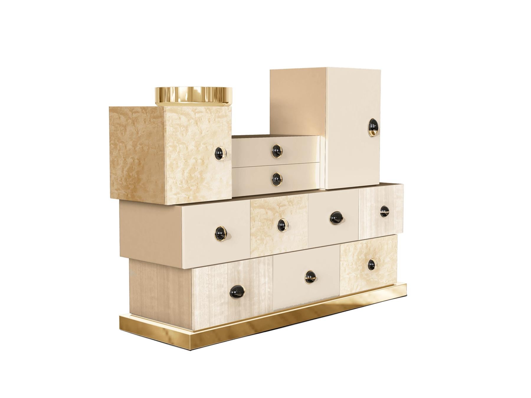 The Matrioska Chest of Drawers is a visual wonder — from its exquisite workmanship to its bold impact. The exceptional design of this modern storage allows it to become a centerpiece in any space it occupies.

Materials: Body in Gloss White Bird Eye