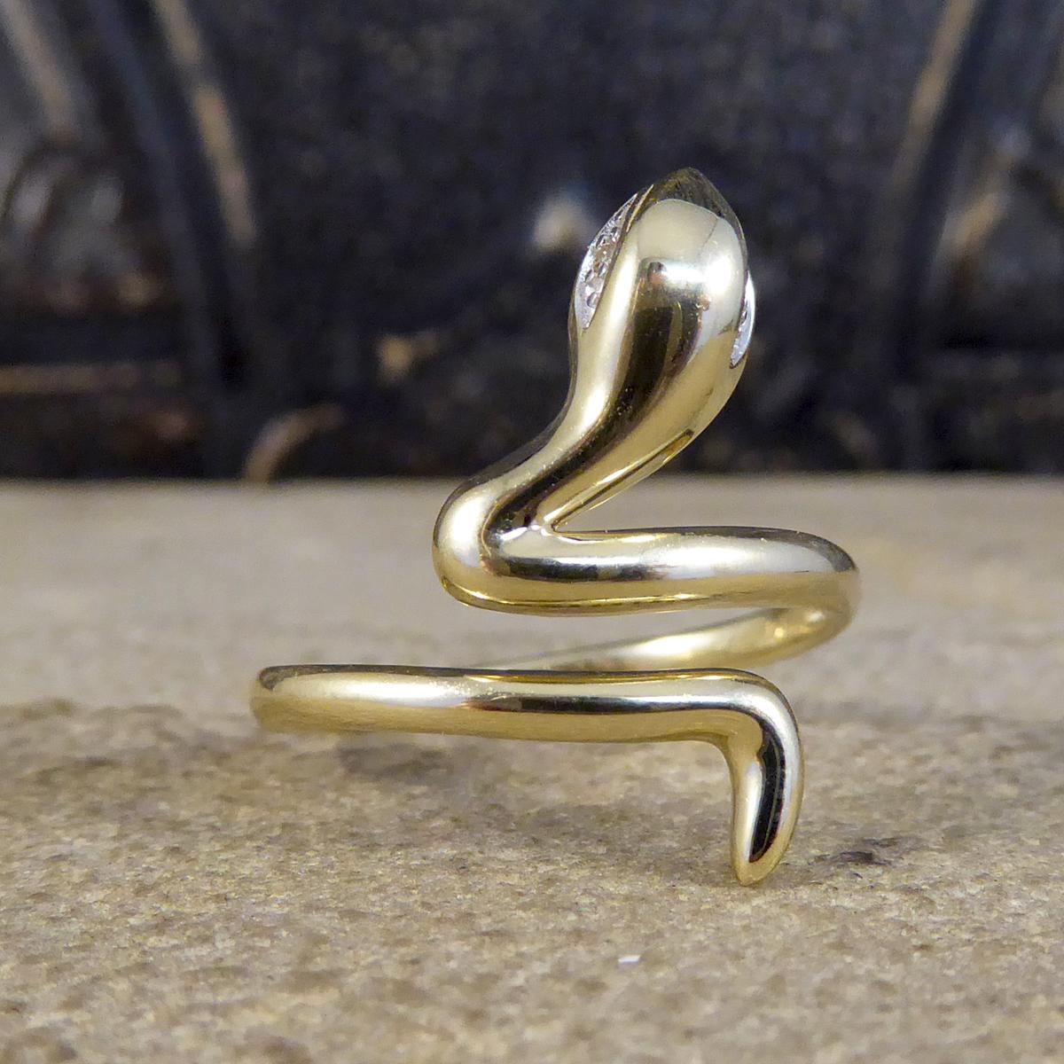 This ring is new and never worn, it is set with 2 Diamonds as eyes. The snake was used in jewellery throughout time to show good luck then was used to symbolise the acknowledgement of eternal love, bringing together a symbolic piece with a modern