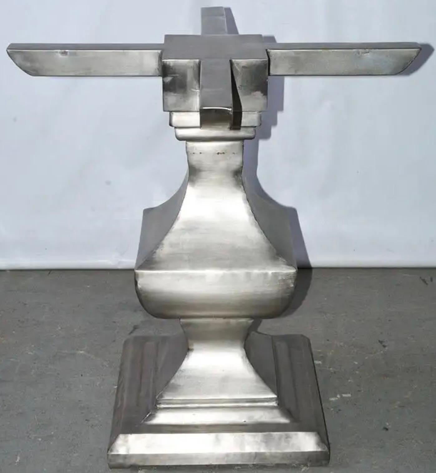 The pedestal table base is made of nickel silvery brushed iron. The style of the pedestal base is the Classic square baluster. The top could be round or square -- glass, wood, stone or marble. Use the pedestal for a dining table, center table,