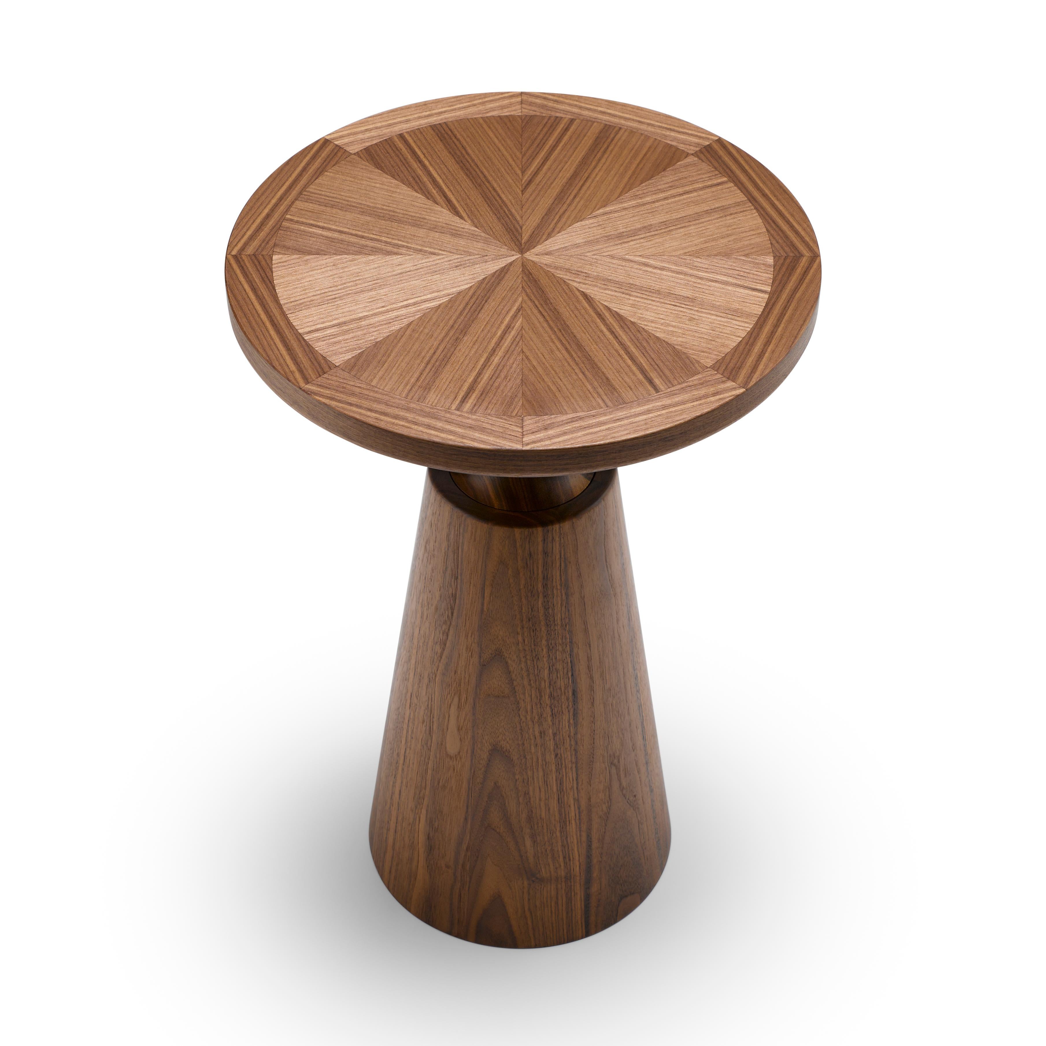 This special edition of one of our most celebrated pieces, the Nicole Side Table, is expertly lathe turned from thick sections of solid seasoned timber. It features a special radial cut veneered top with cross-branding. An elegant finishing piece to