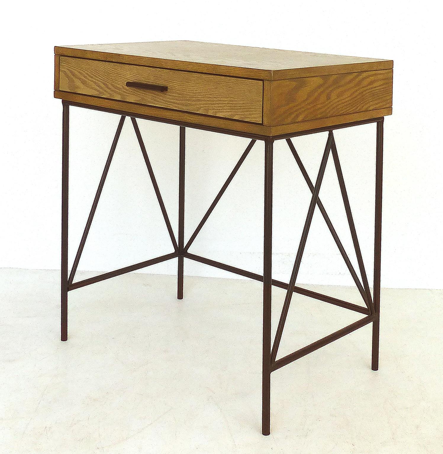 Contemporary nightstand side tables with iron bases, pair

Offered for sale is a contemporary pair of heavily grained nightstands or side tables with wrought iron bases and stretchers. These tables have a great look that will complement and