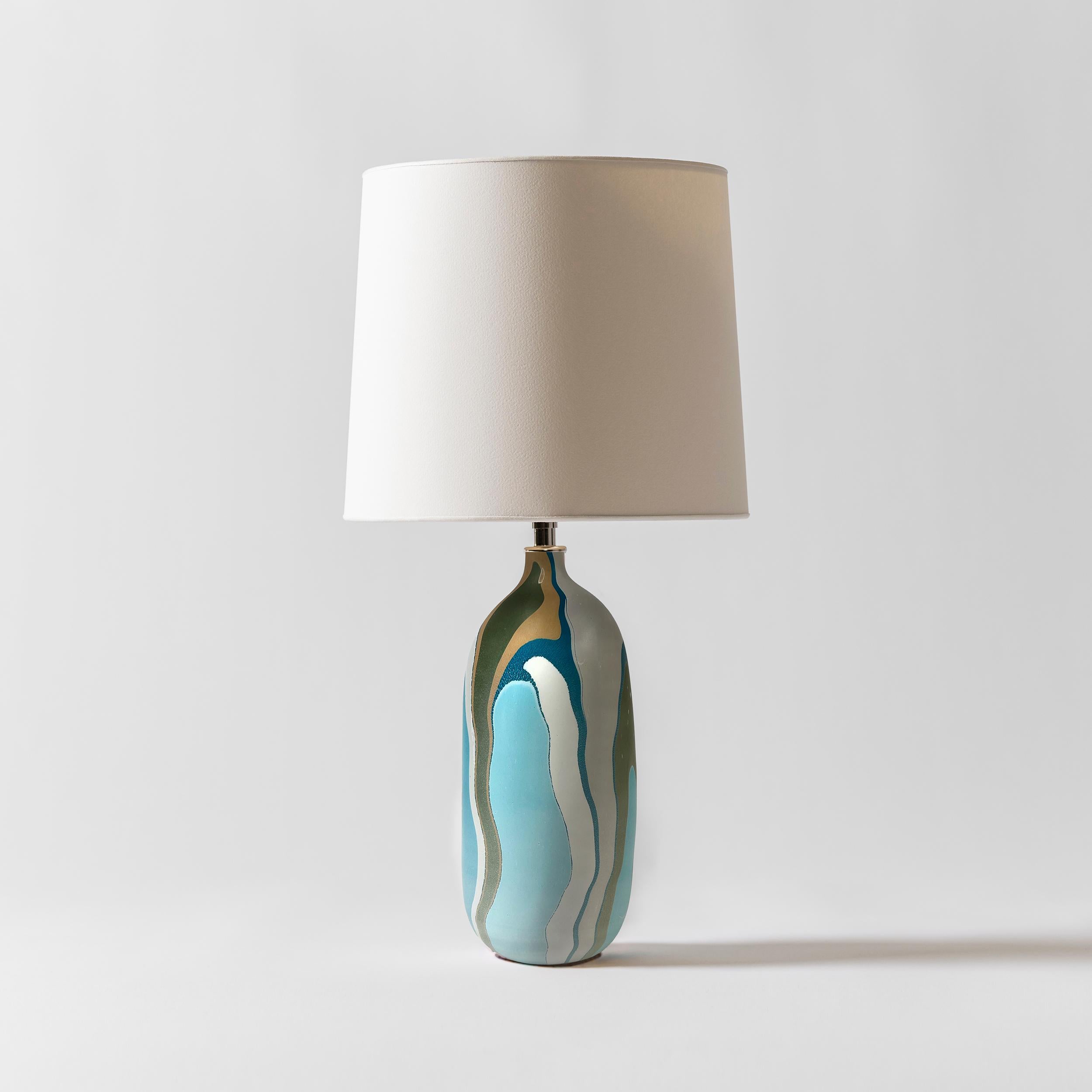 Our Hydro collection is inspired by the grooves and patterns that waterways make through the landscape as seen from above. The layers of gradation in the pigment on the exterior of the bases reference topographical maps. We take queues for our