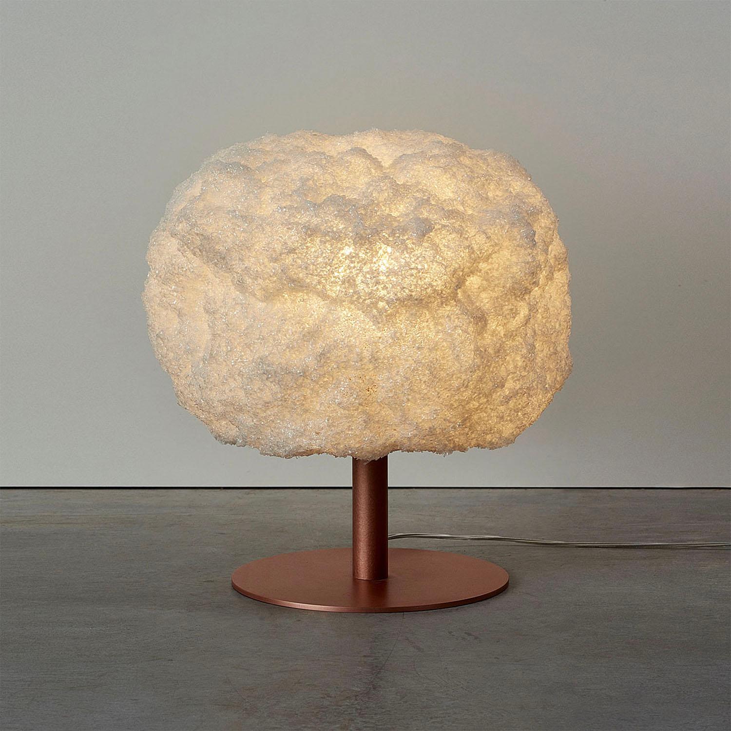 Contemporary off-white table lamp - storm light copper by Johannes Hemann.
Material: polycarbonate, copper
Dimensions: Ø 38 x H 45 cm
Material options: white, grey, blue

The Storm Series is by its concept the purest example of a process-design,