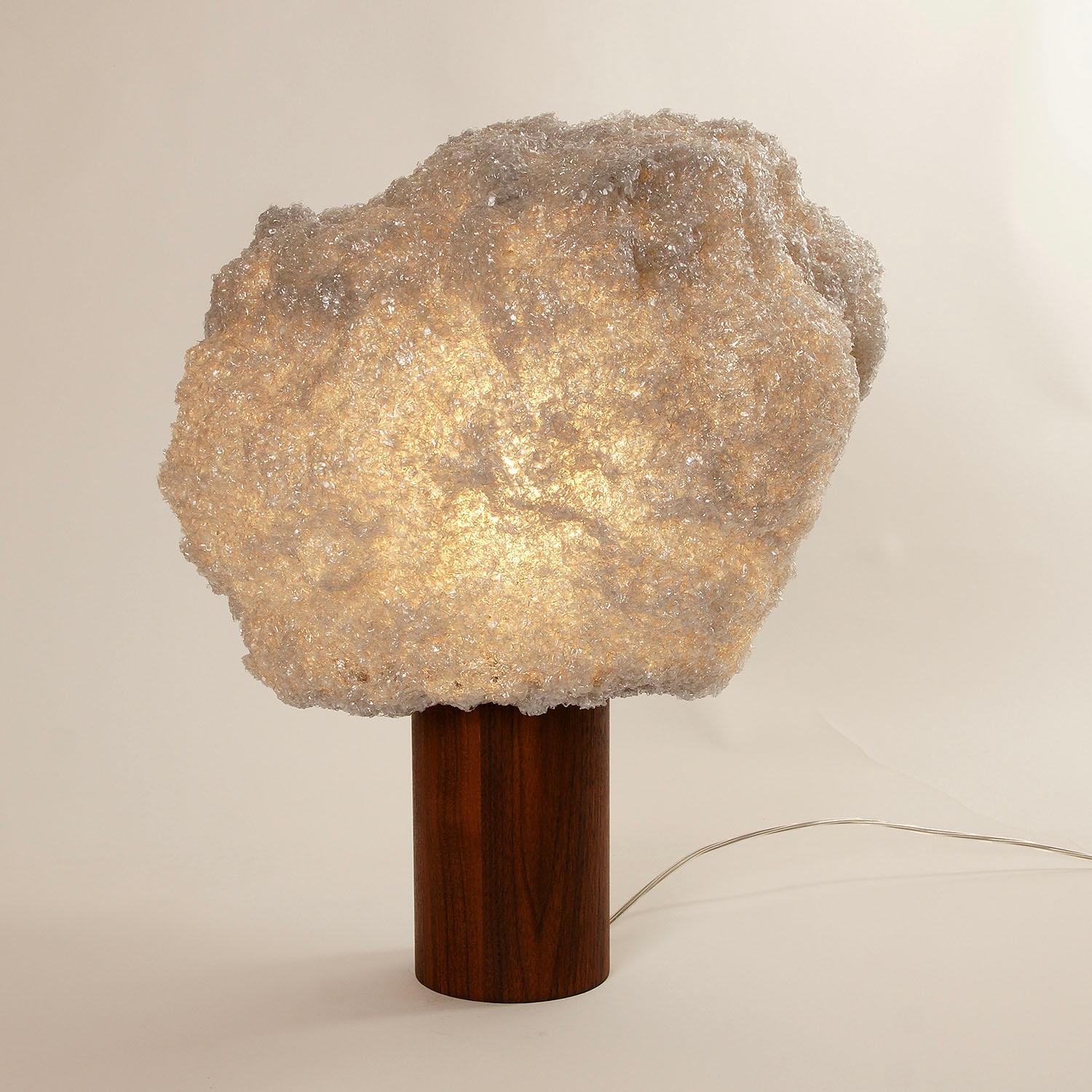 Contemporary Off-White Table Lamp - Storm Light Walnut by Johannes Hemann.
Material: Polycarbonate, Walnut
Dimensions: Ø 42cm x H 52 cm
Material options: white, grey, blue

The Storm Series is by its concept the purest example of a