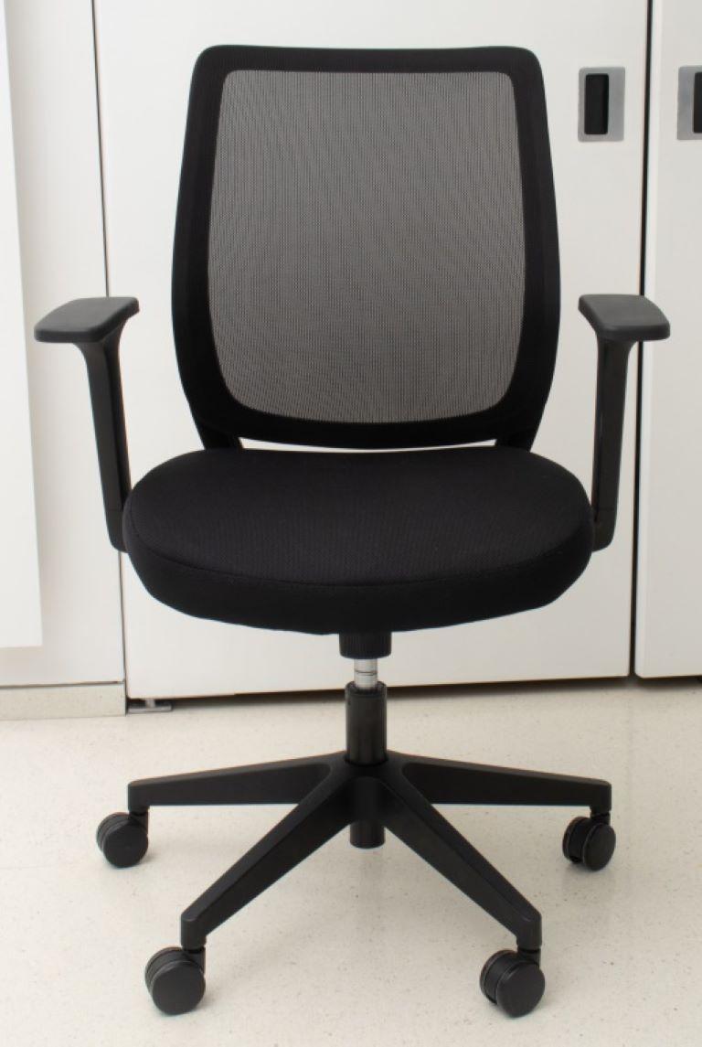 Office chair, black, in the manner of the Aero chair, with synthetic back, black seat, and adjustable back arms, and seat. 