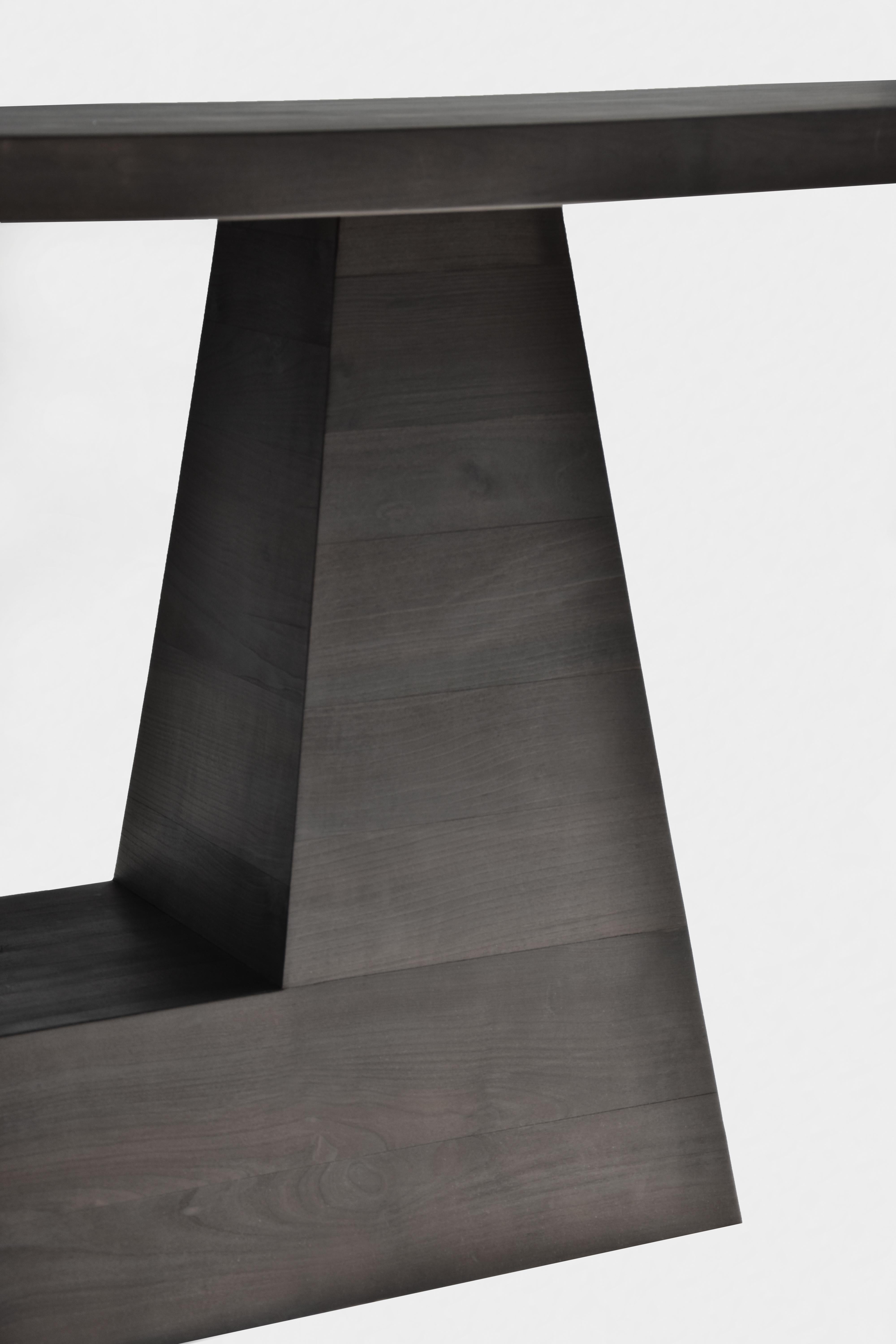 OKA Console Table by German contemporary design studio Eichkorn. 
Material: Burnt Cherry Wood
Standard size: H.75 x 170 x 45 cm - Customizations are possible

Also available as dining table.

The puristic design should serve as a statement for the