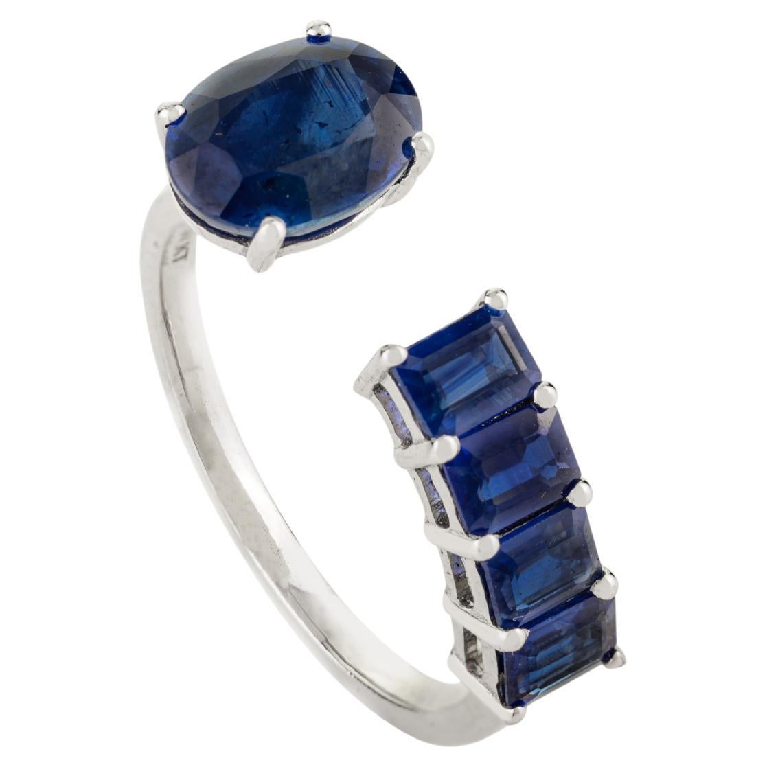 For Sale:  Contemporary Open Band Ring with 14k White Gold Oval and Baguette Blue Sapphire