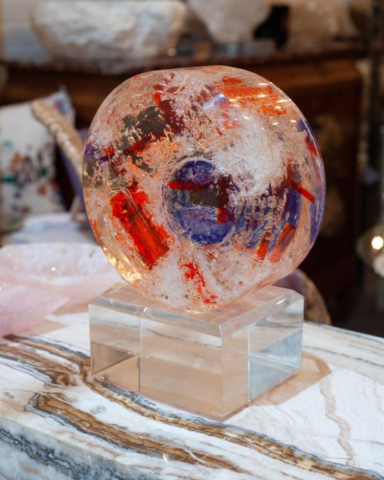 An acrylic sculpture by a Cuban artist, cast in crystal-clear acrylic and infused with striking tones of orange and blue. Radiant and ever-changing, it captures the light beautifully—offering a dynamic play of color and perspective from every angle.