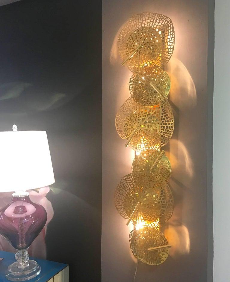 We give you the outside to bring into your interiors! The brass leaves of different sizes on these Art Deco Design sculpture wall lights introduce nature, they are uniquely engraved and a laser-cut Work of Art, 
Concealing pierced concave discs