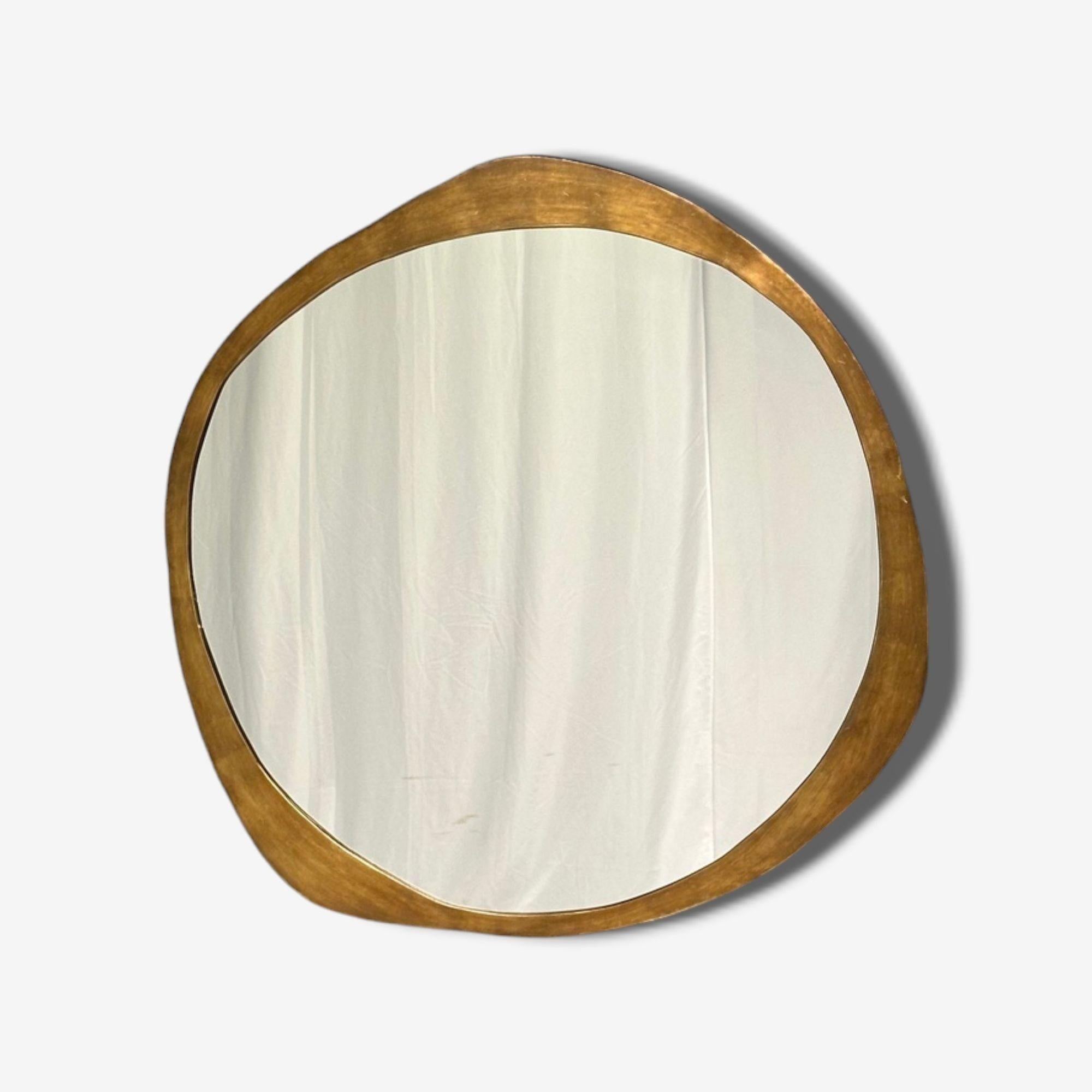 Contemporary, Organic Modern, Freeform Wall, Console, or Pier Mirror, Brass, 21st C.
A single organic modern wall mirror having a freeform brushed brass frame and clear center mirror panel. 
Brass, Mirror; Italy, 21st c.
Diameter: 41 inches