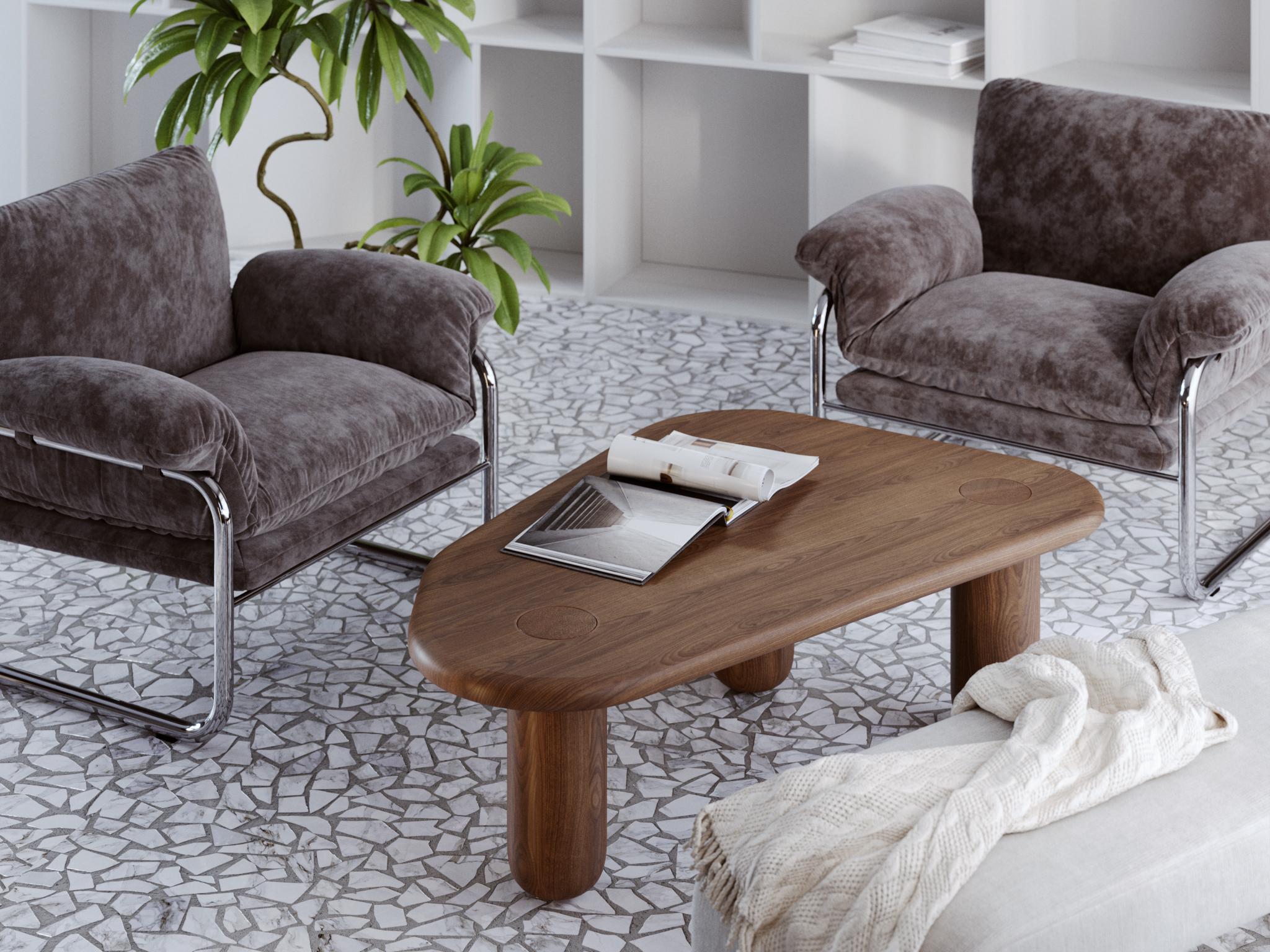 
This contemporary coffee table is crafted from solid oak and finished in deep black, emphasizing both the natural grain of the wood and the bold sculptural silhouette. Its organic form with rounded edges and cylindrical legs creates a sense of