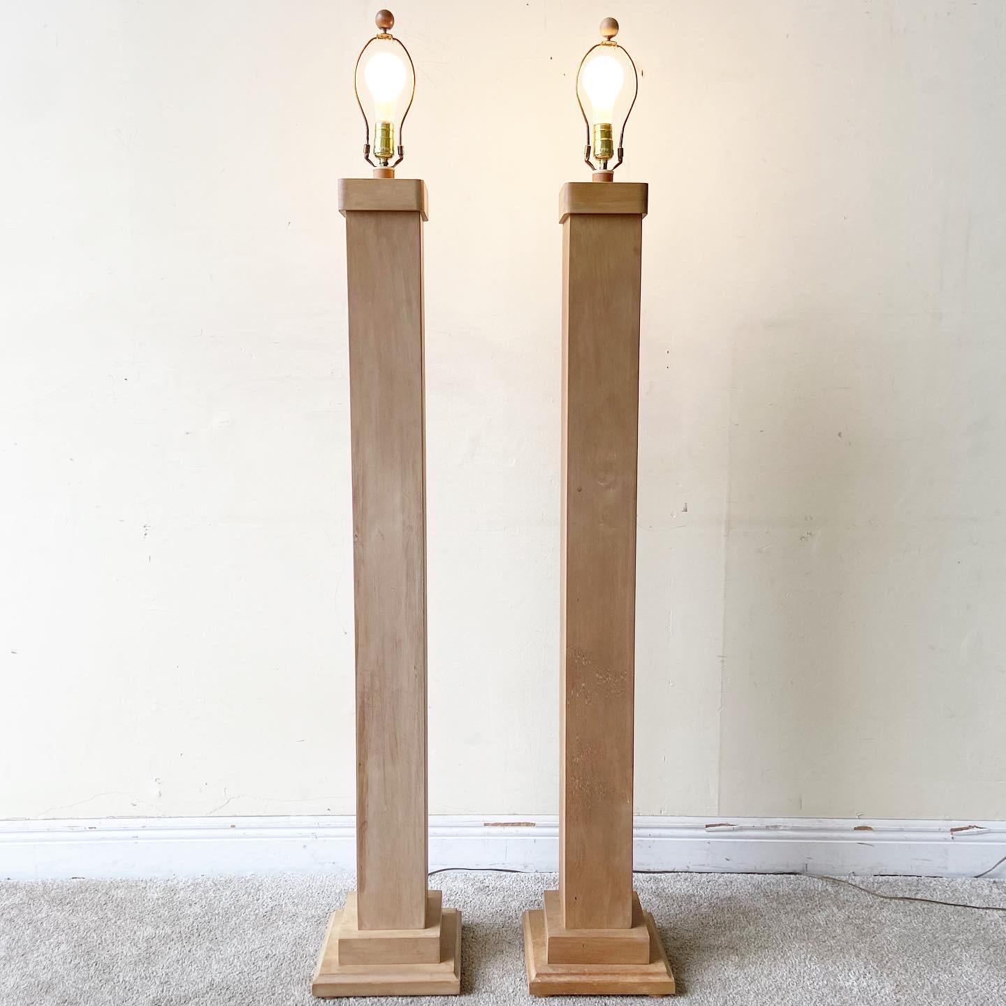Exquisite pair of wooden pillar floor lamps. Each feature an organic tone column body.

Additional information:
Material: Wood
Color: Brown
Style: Mid-Century Modern, Organic
Time Period: 1970s
Place of origin: USA
Dimension: 10