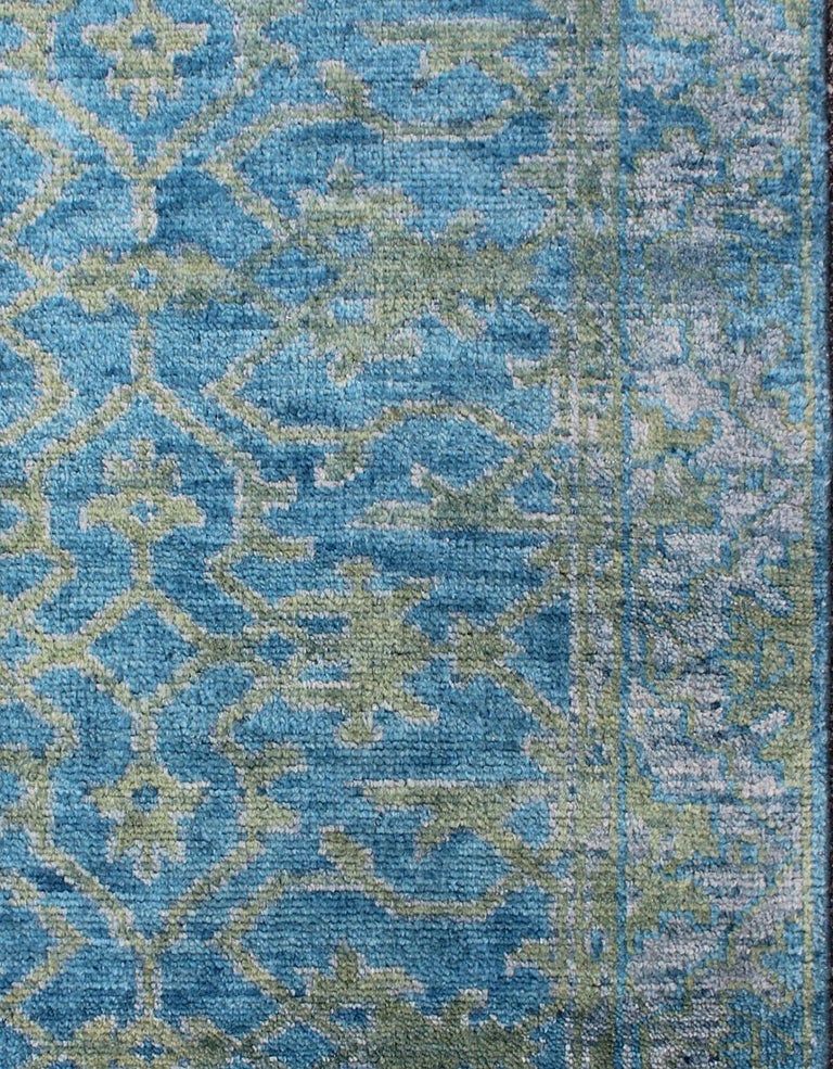 Keivan Woven Arts, OB-103433373, Contemporary Oushak Design rug- 
Measures: 4' X 6'
This hand-knotted Oushak rug is rendered in green, silver gray and blue.