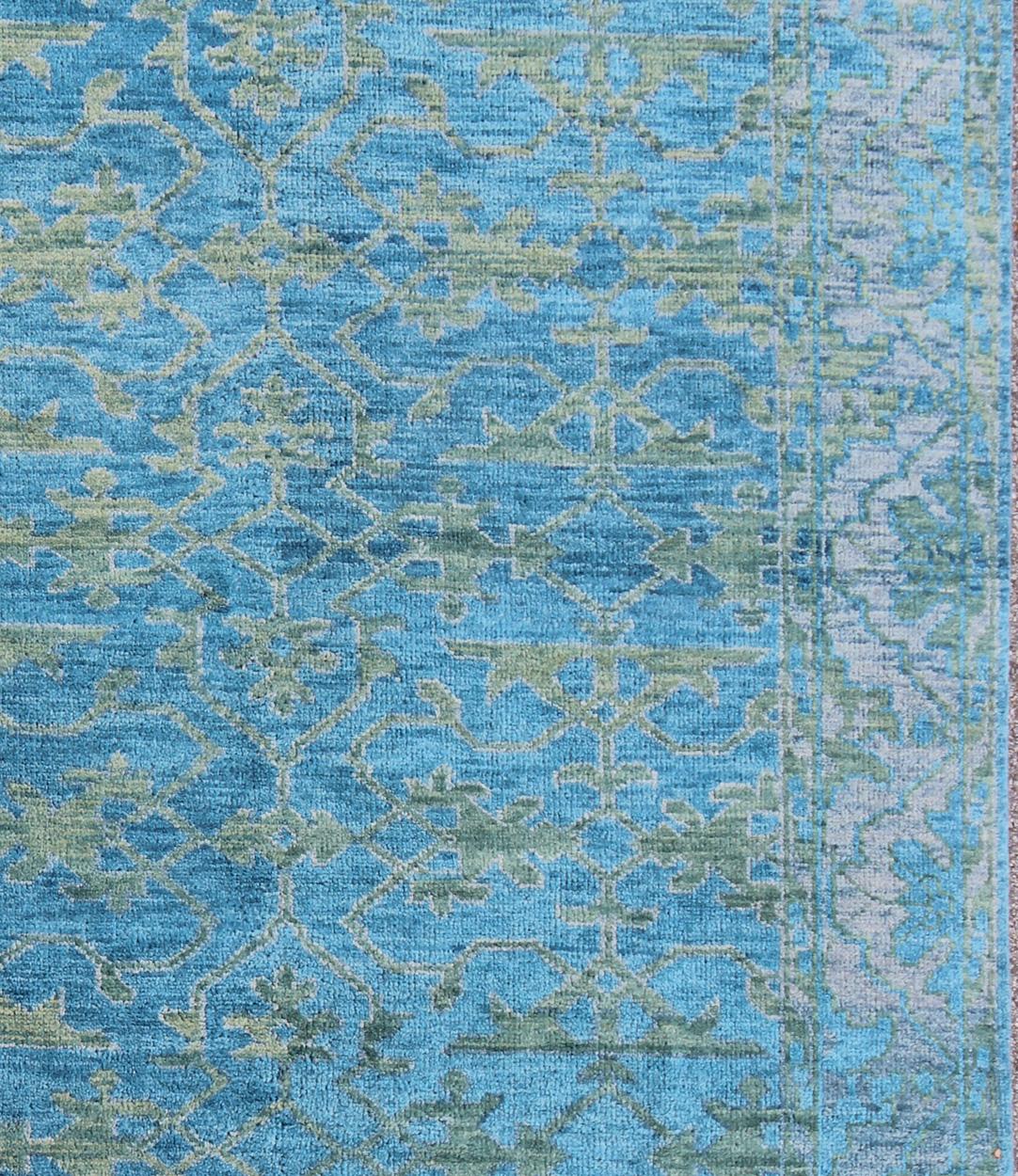 This magnificent Oushak features a splendid blue hued design at its center, with a lovely green and the complementary border however is rendered in some green hues.

Measures: 7'9 x 9'9 

Contemporary Oushak Design Rug by Keivan Woven Arts, rug