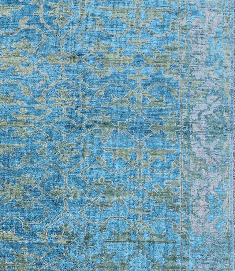 This magnificent Oushak features a splendid blue hued design at its center, with a lovely blue background, the complementary border however is rendered in some green and grayish hues.

Measures: 7'9 x 9'9 

 Blue Oushak, rug
