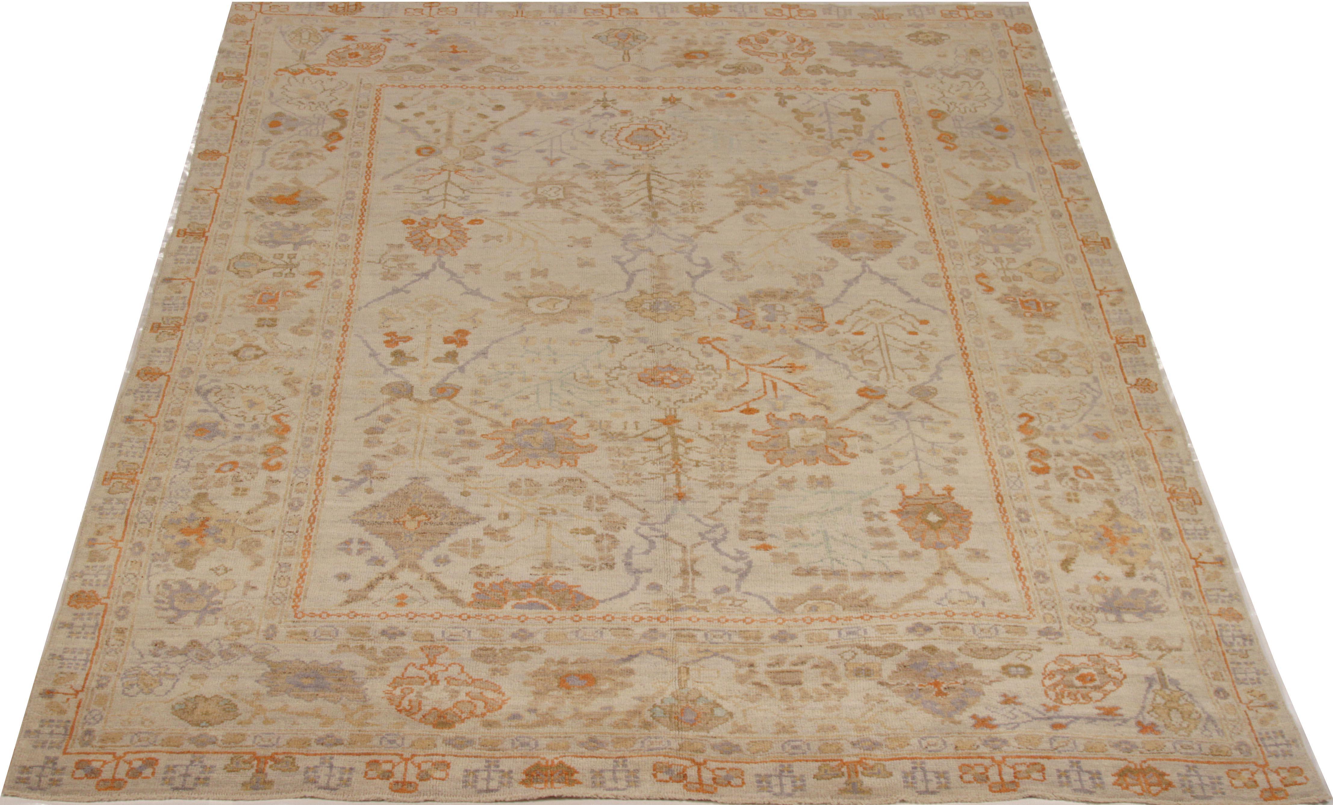Handwoven Persian rug from fine wool and rich vegetable dyes. It’s a new production piece created in the tradition of ancient Oushak weaving. It features Classic floral details in blue and orange hues over a beige field. It’s a great rug for modern,