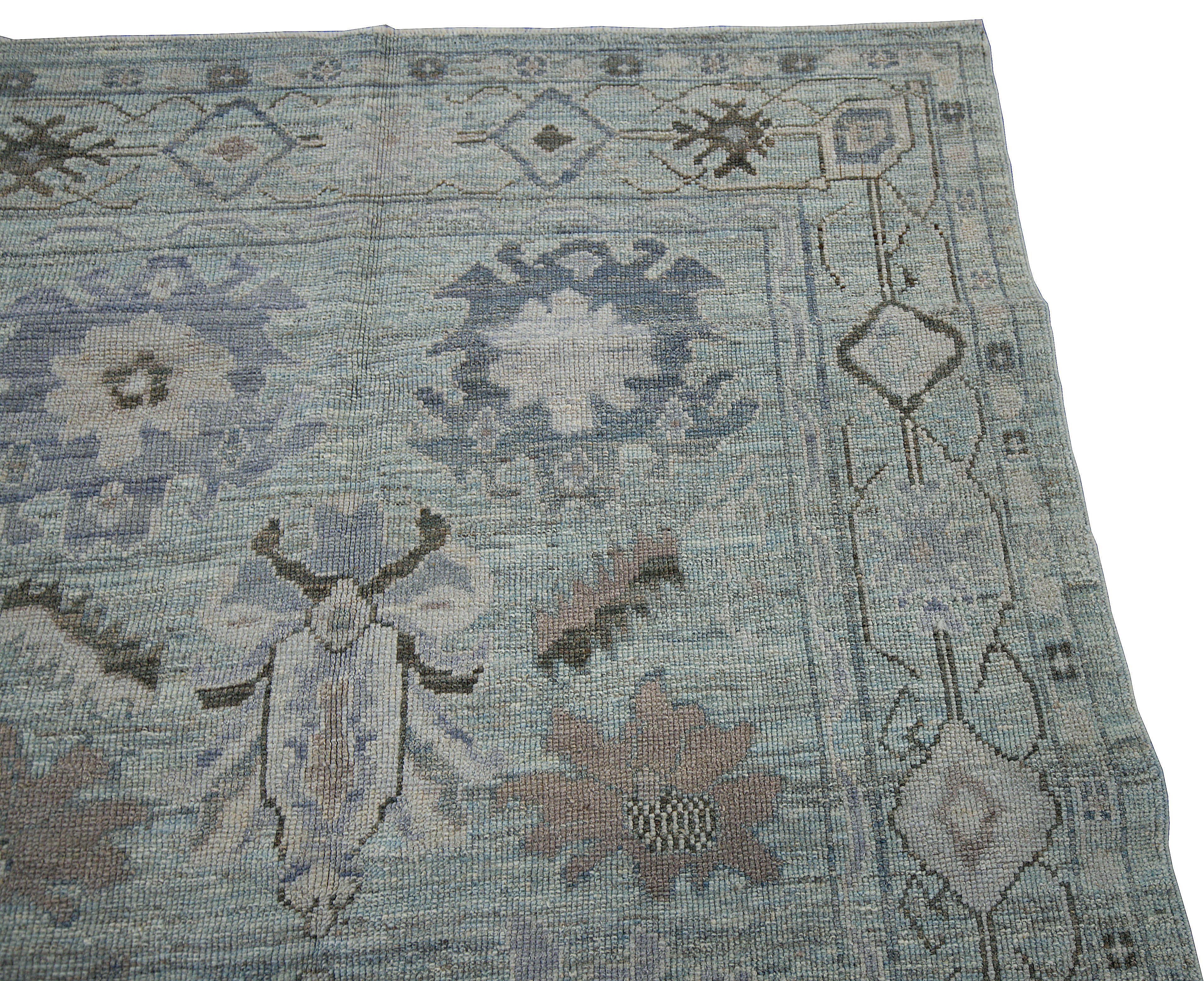 Hand-Woven Contemporary Oushak Rug with Blue Field and Floral Patterns in Black and Gray For Sale