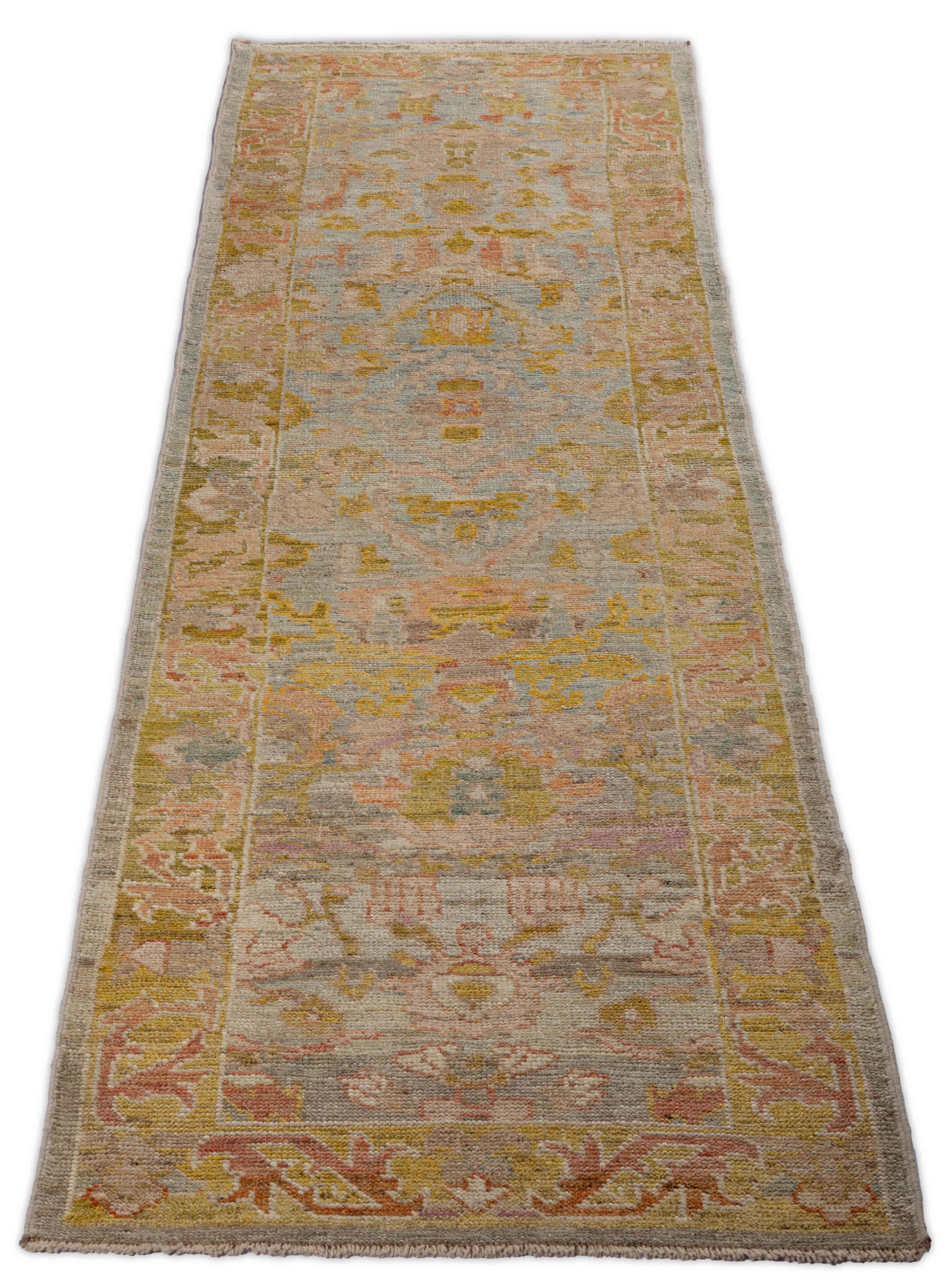  New Turkish rug made of handwoven sheep’s wool of the finest quality. It’s colored with organic vegetable dyes that are certified safe for humans and pets alike. It features a large, beige field with flower details allover in pink and gold