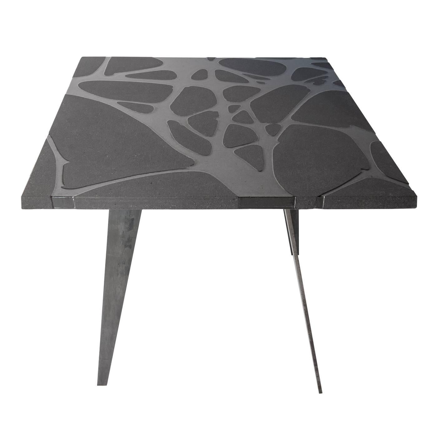 Filodifumo is a contemporary square outdoor table with top in lava stone and steel legs.
It is made with solid and compact matter.
High precision machinaries engrave on the lava stone surface 