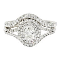 Contemporary Oval Diamond 14 Karat White Gold Engagement Ring Wedding Set