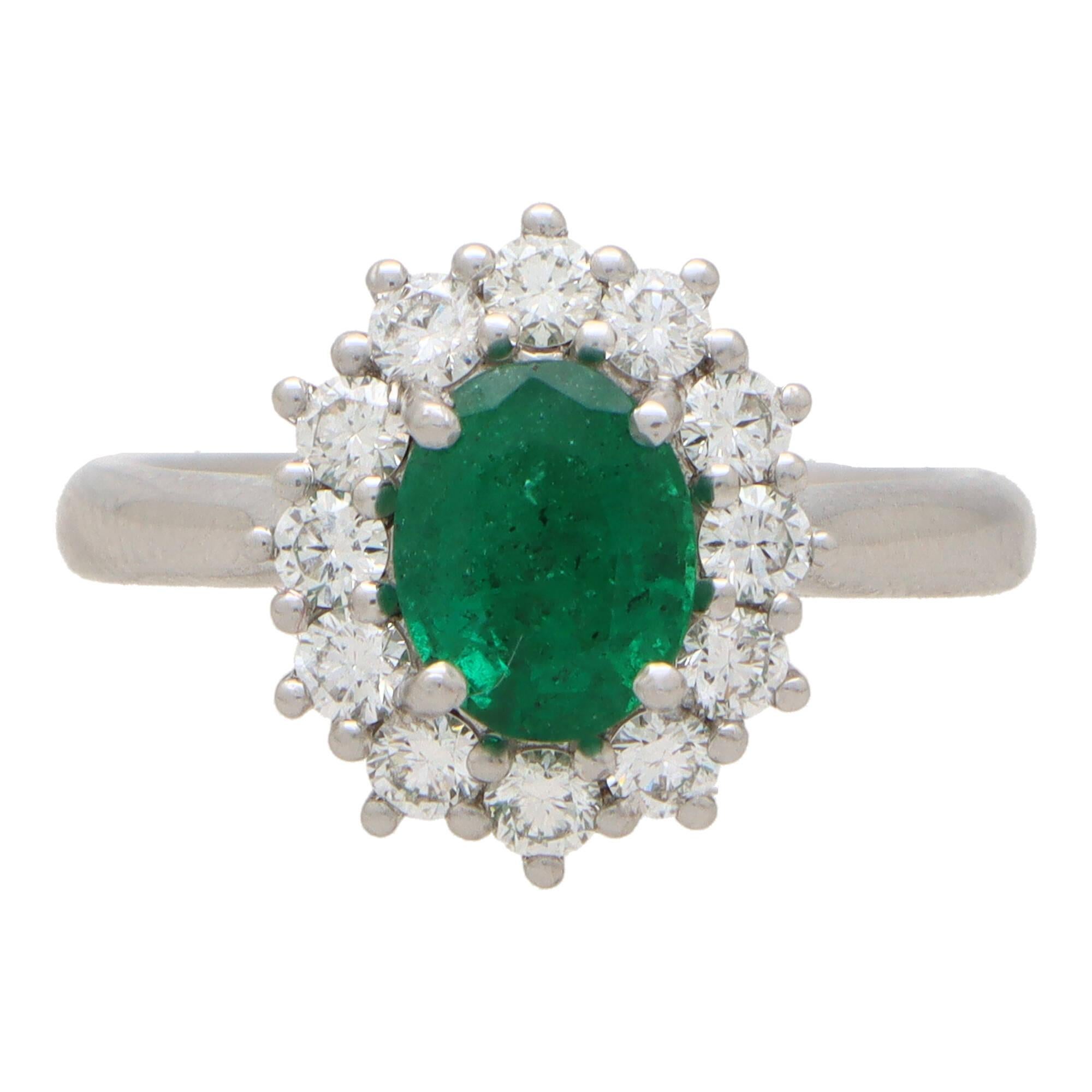 Modern Contemporary Oval Emerald and Diamond Cluster Ring Set in Platinum For Sale