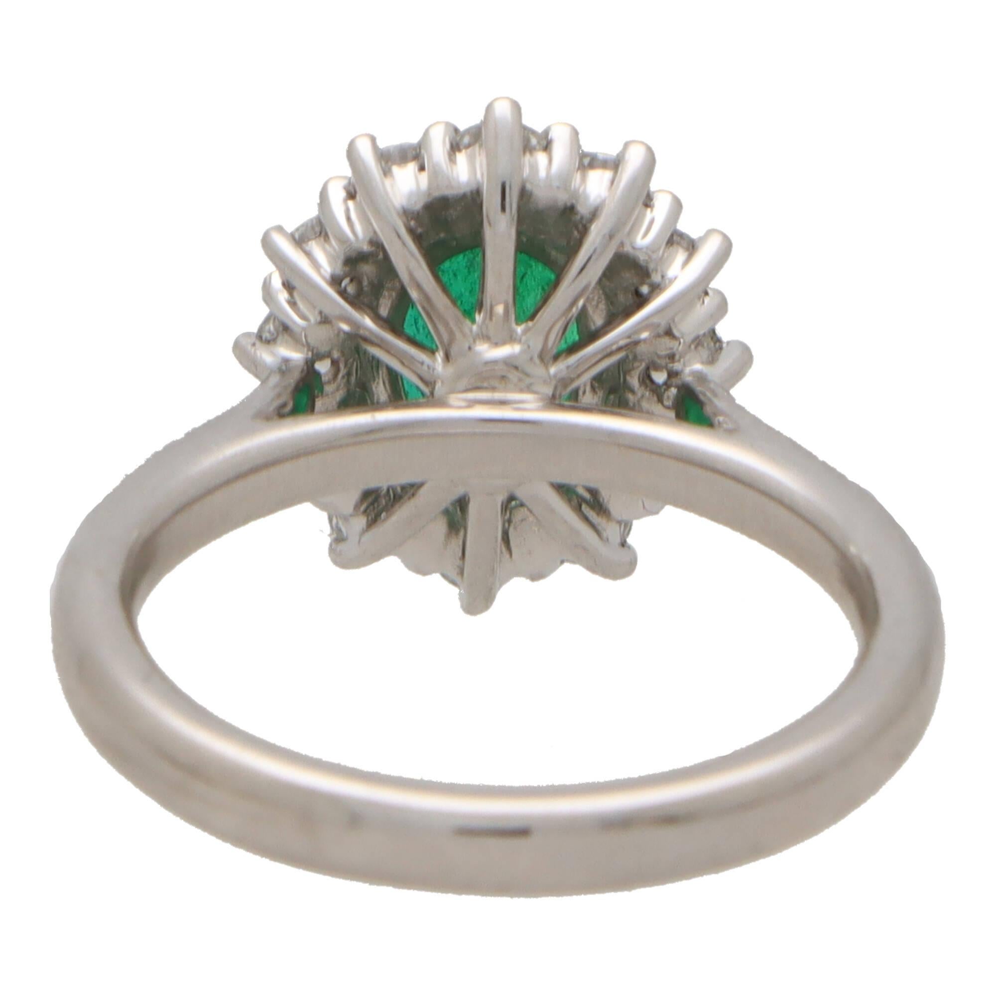 Women's or Men's Contemporary Oval Emerald and Diamond Cluster Ring Set in Platinum For Sale