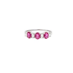 Contemporary Oval Ruby Ring with Emerald Cut Diamond Spacers in 18k White Gold