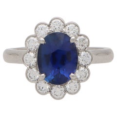 Contemporary Oval Sapphire and Diamond Cluster Ring Set in Platinum