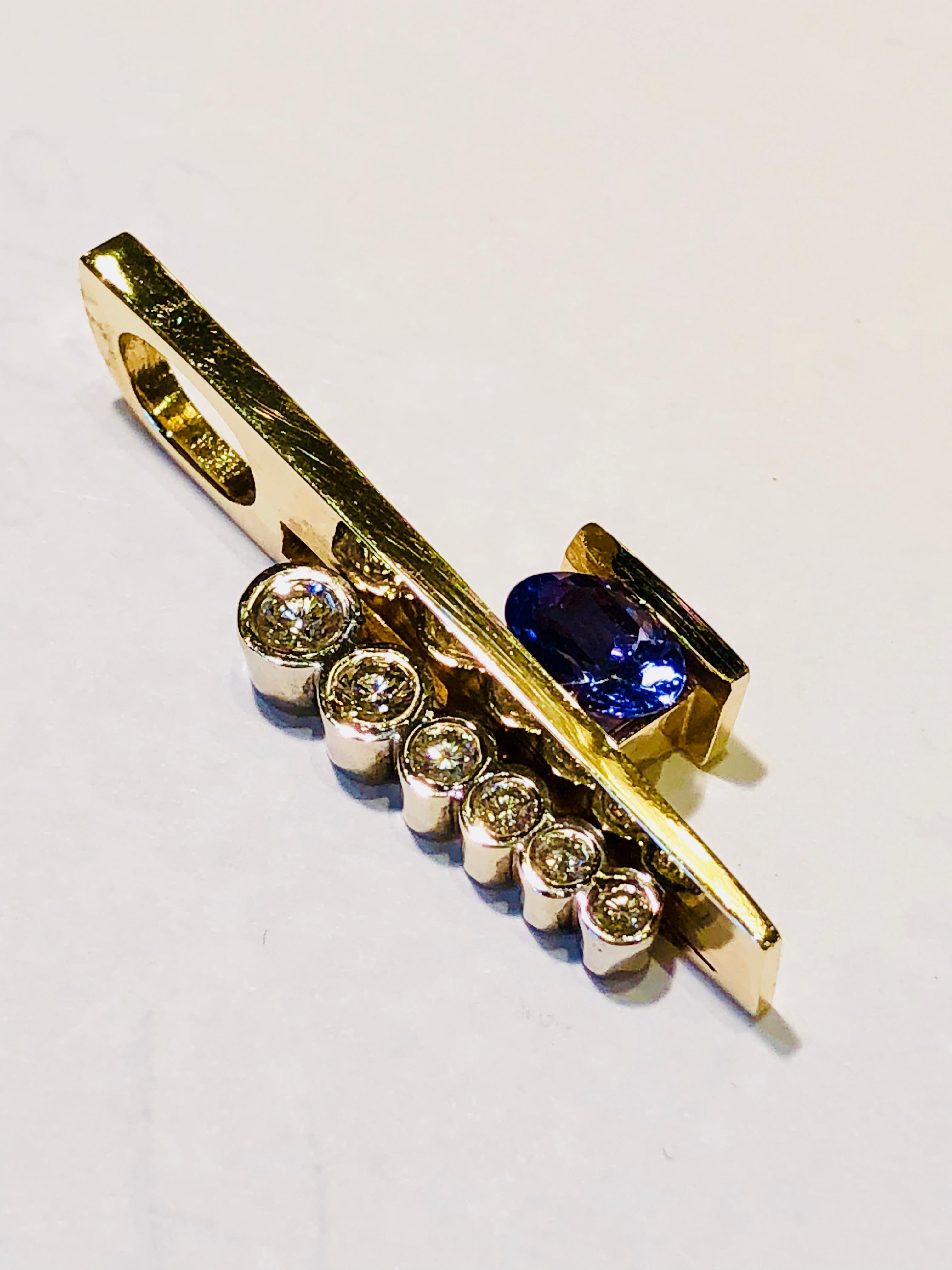 Women's Contemporary Oval Tanzanite and Round Diamond Modern Two-Tone Gold Omega Pendant