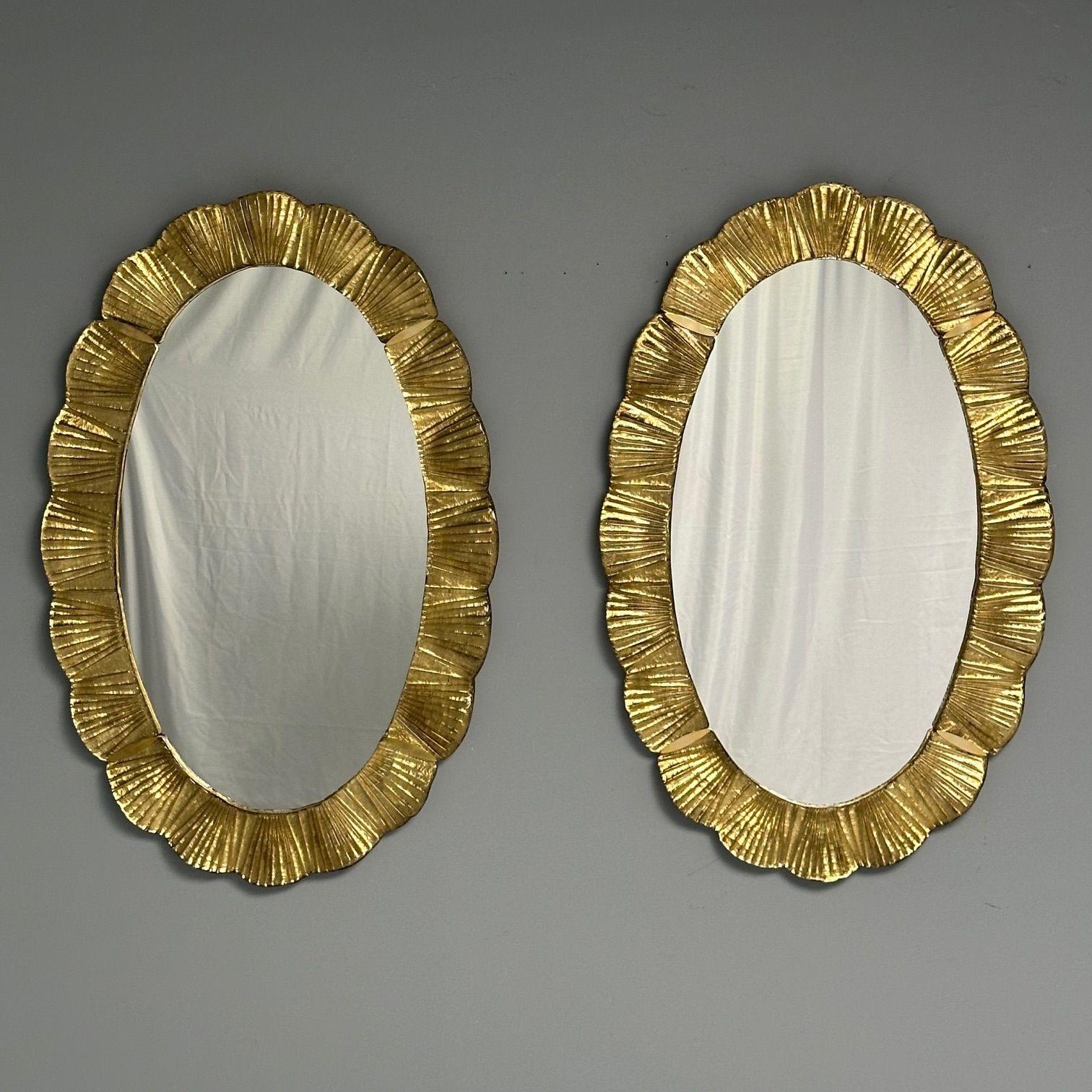 Contemporary, Oval Wall Mirrors with Scallop Motif, Murano Glass, Gilt Gold, Italy, 2023

Pair of rectangular wall mirrors designed and handcrafted in a small workshop in Venice, Italy. Each mirror has a silver shell motif Murano glass frame and
