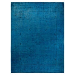 Tappeto contemporaneo in lana sovratinta annodata a mano di colore blu