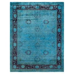 Tapis de sol contemporain en laine surteinte nouée à la main, bleu
