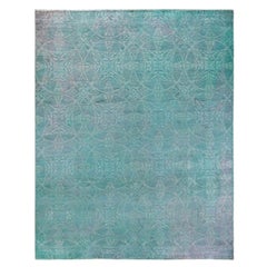 Tapis de sol contemporain en laine surteinte nouée à la main, bleu