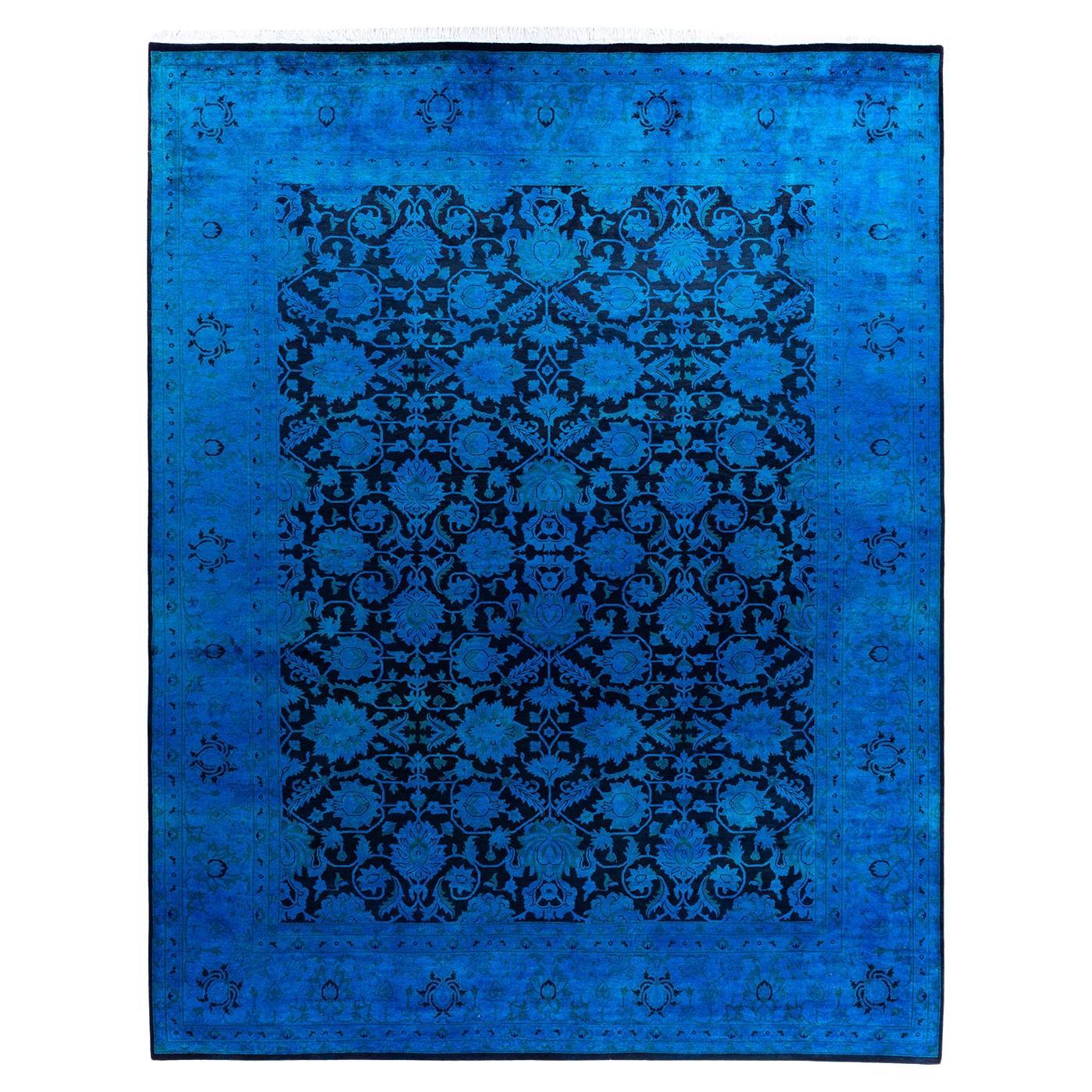 Tappeto contemporaneo in lana sovratinta annodata a mano di colore blu