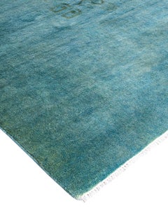 Tapis de sol contemporain en laine surteintée nouée à la main bleuâtre