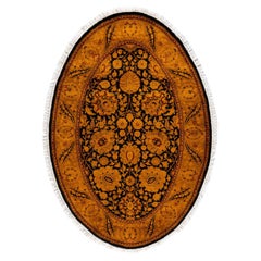 Alfombra ovalada contemporánea de lana anudada a mano teñida de oro