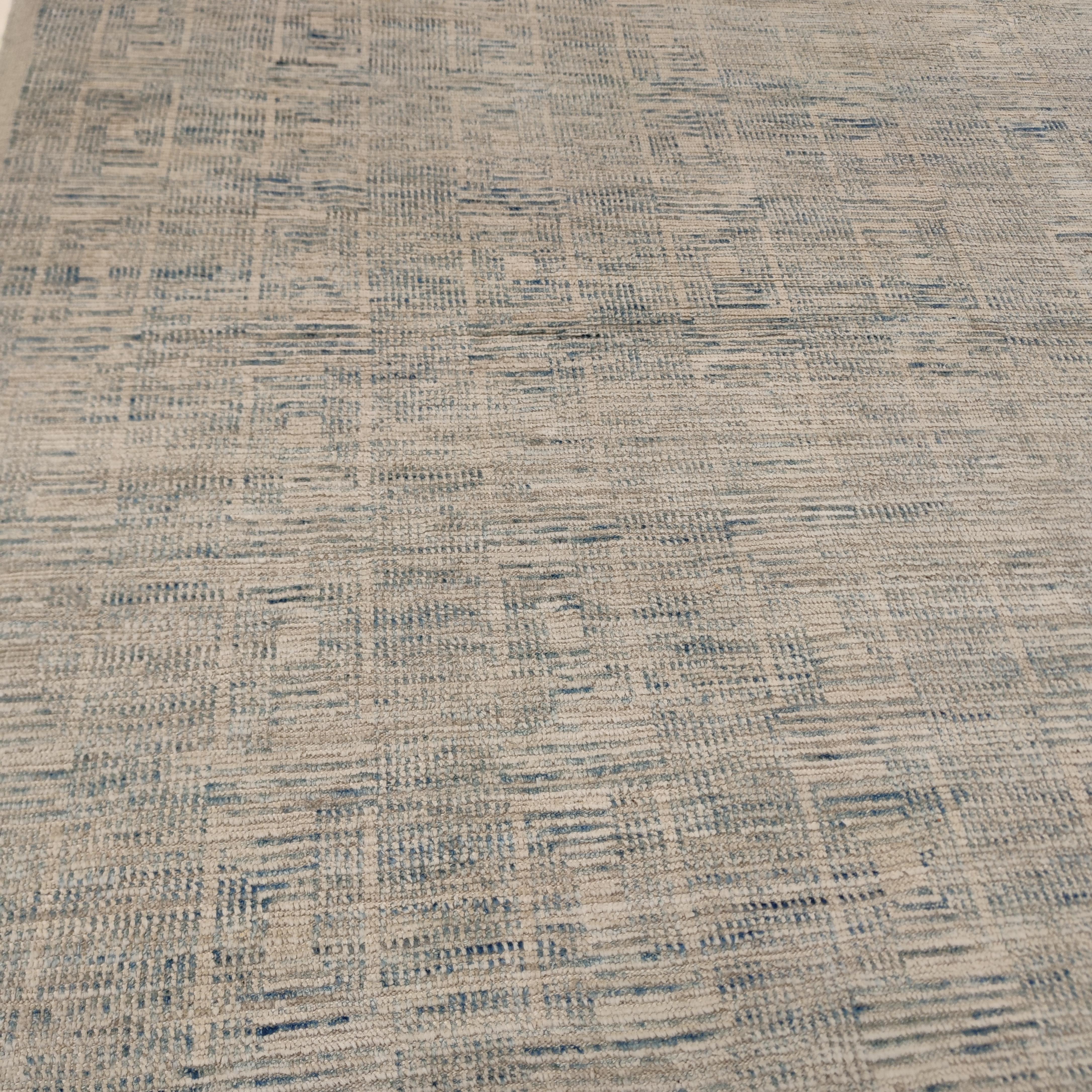 Jansen is a unique example from our textured collections of contemporary rugs, expressing at its best the subtle balance between the warm tonalities of Moroccan Berber rugs and the intricate geometries of Scandinavian Modern design, obtained through